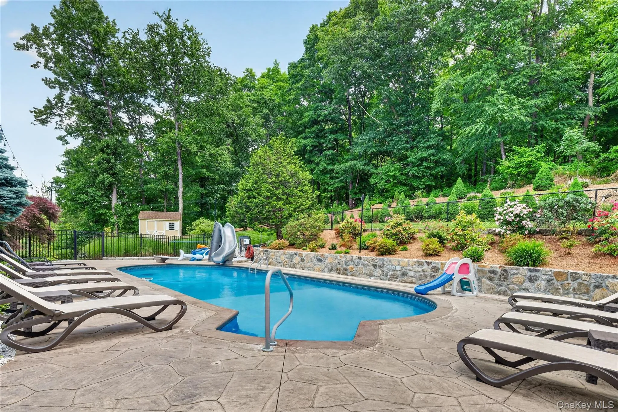 Diving board, slide and wide steps into the pool. You choose your point of entry! Diving board, slide and wide steps into the pool. You choose your point of entry!
