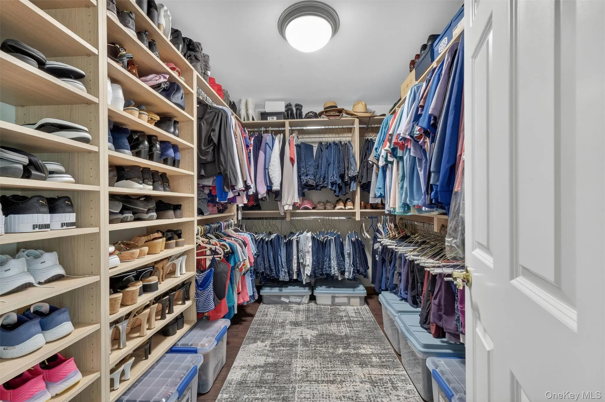 Primary walk-in closet. Primary walk-in closet.