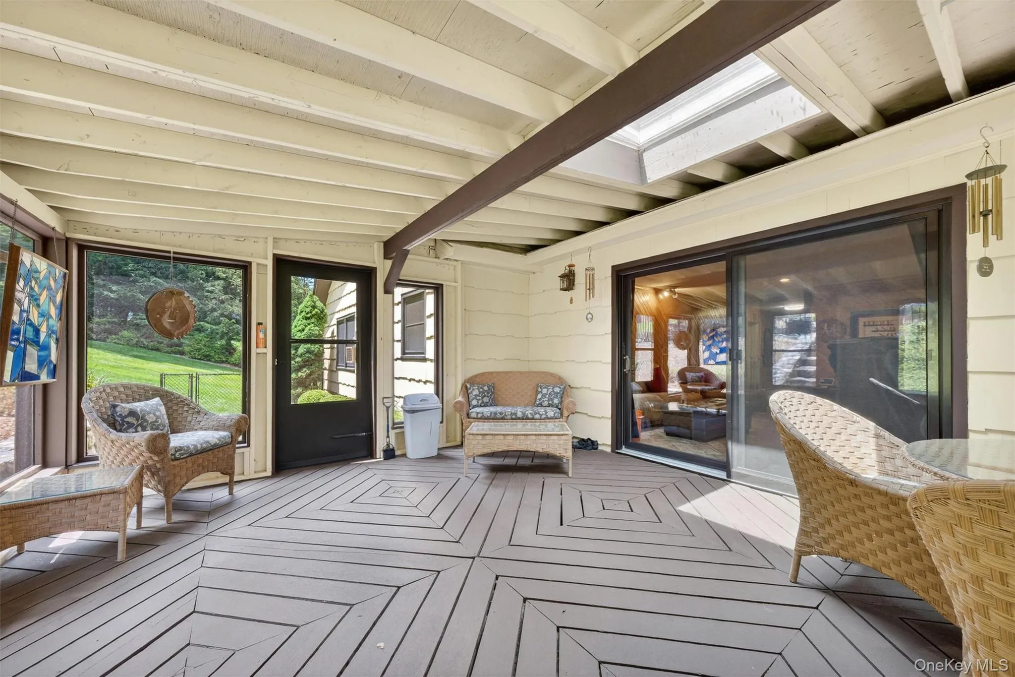 Screened-in porch off the den. Screened-in porch off the den.