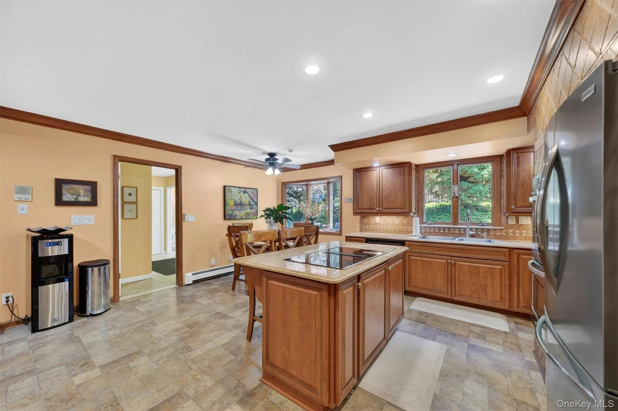 Eat in kitchen with lots of cabinet and counter space, stainless steel appliances, and stone countertops. Eat in kitchen with lots of cabinet and counter space, stainless steel appliances, and stone countertops.