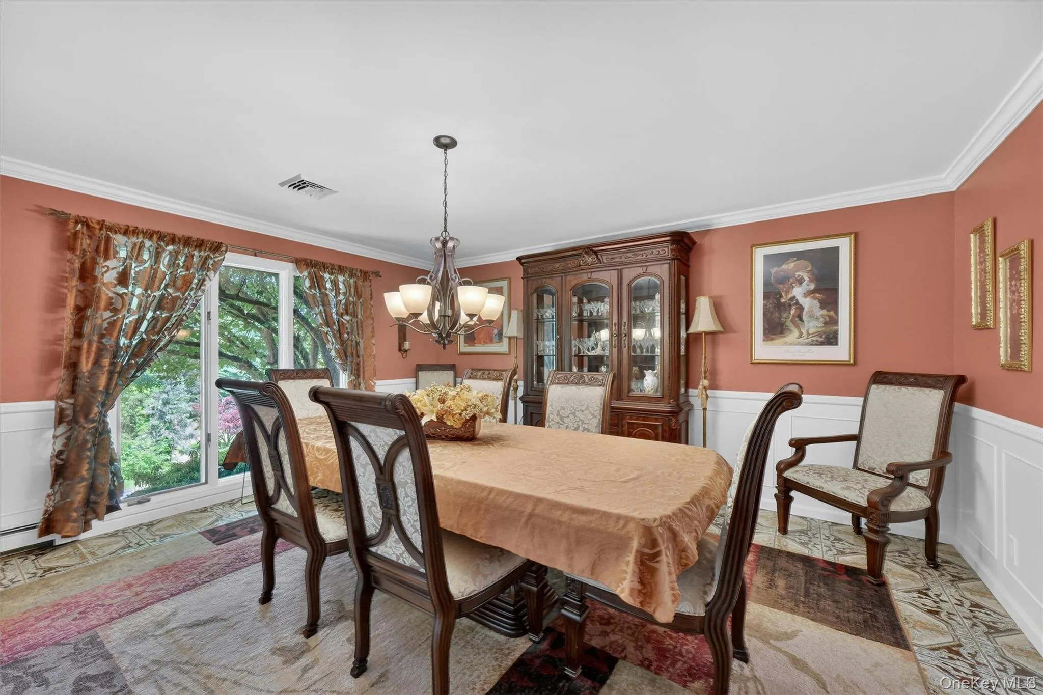 Formal dining room with wainscoting and crown molding. Formal dining room with wainscoting and crown molding.