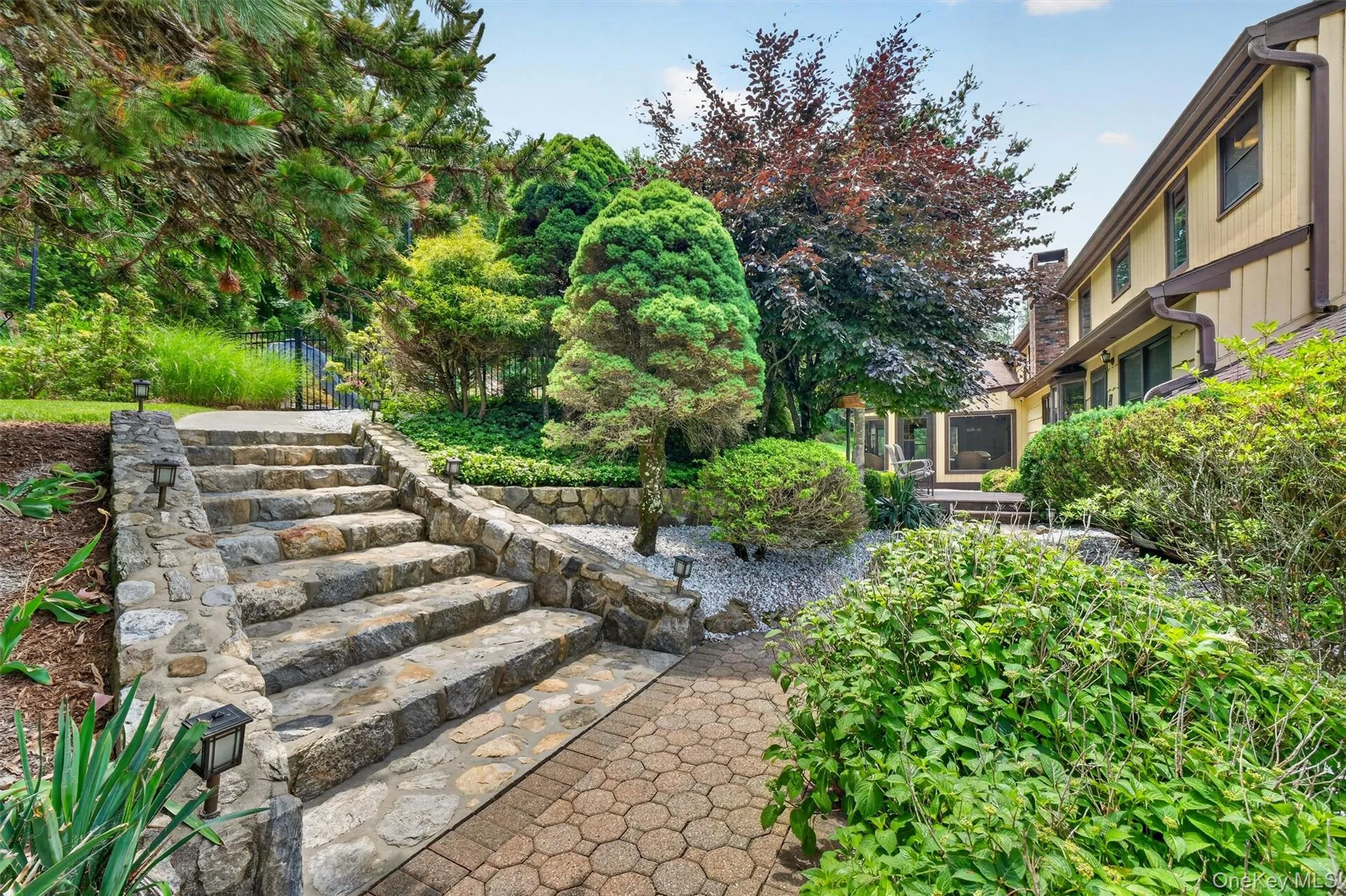 Beautiful, custom stone steps and stone walls around the pool and backyard. Beautiful, custom stone steps and stone walls around the pool and backyard.