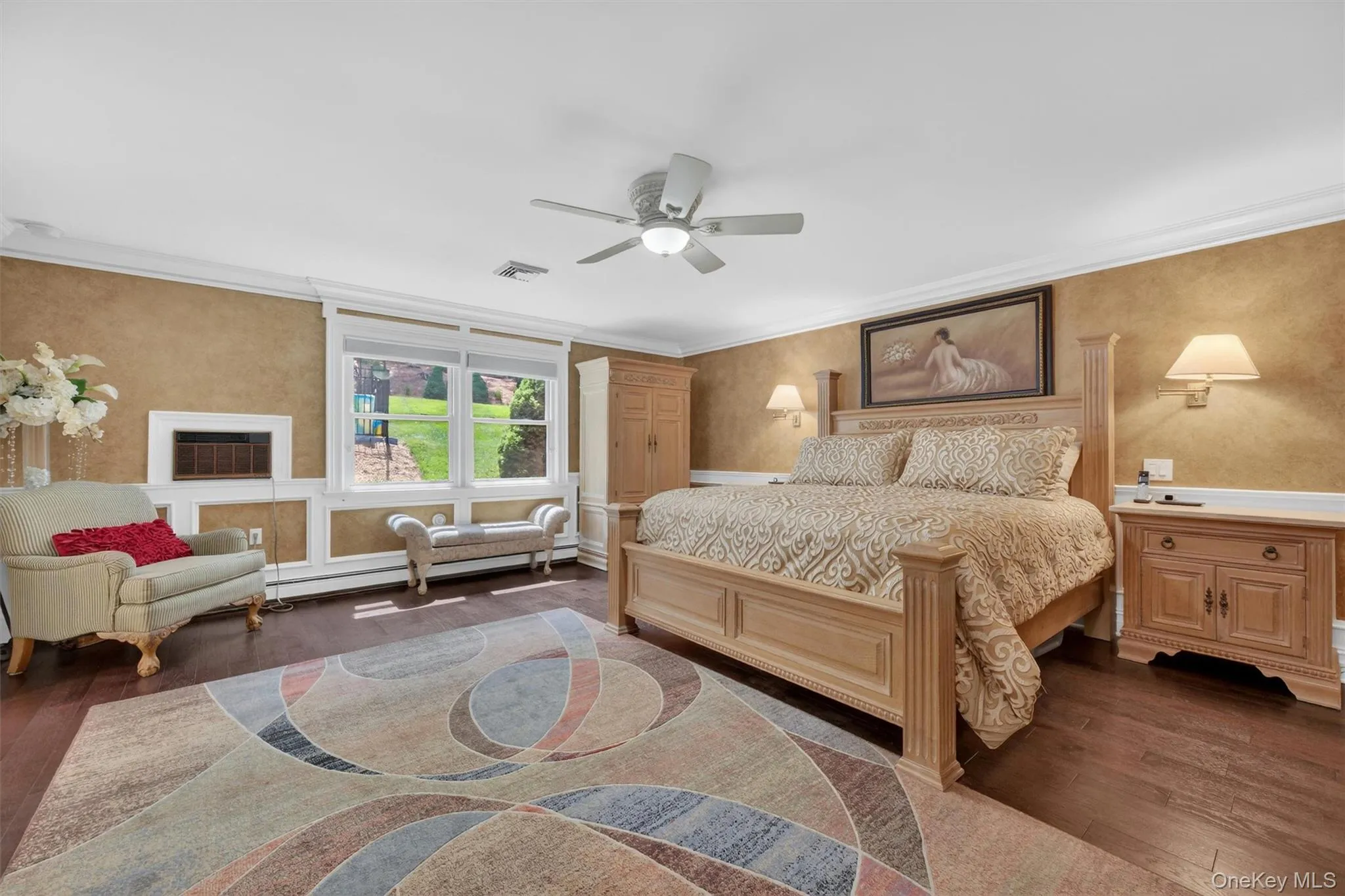 Oversized primary bedroom with views of the backyard. Oversized primary bedroom with views of the backyard.
