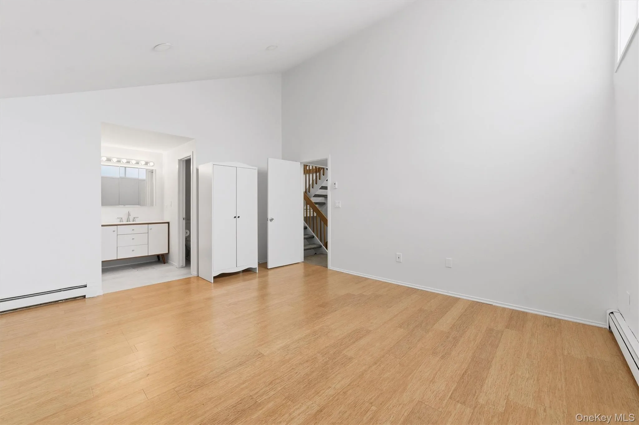 Large Primary bedroom with large windows, a walkout balcony, a walk-in closet, and a bathroom with a shower. All fully renovated Large Primary bedroom with large windows, a walkout balcony, a walk-in closet, and a bathroom with a shower. All fully renovated