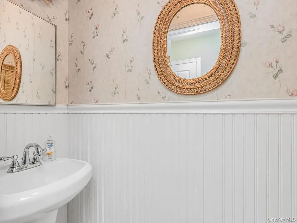 Convenient half bath off hallway Convenient half bath off hallway