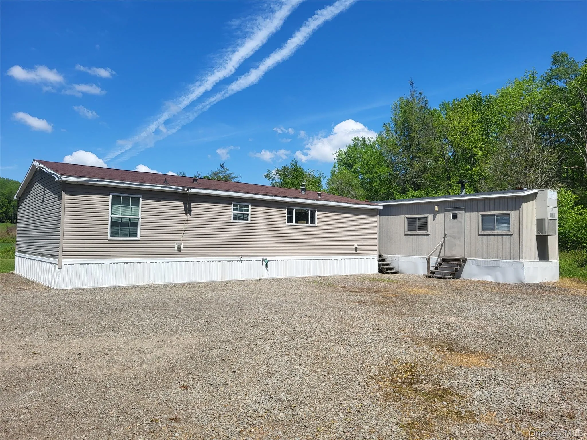 Back of home/featuring office trailer on right Back of home/featuring office trailer on right