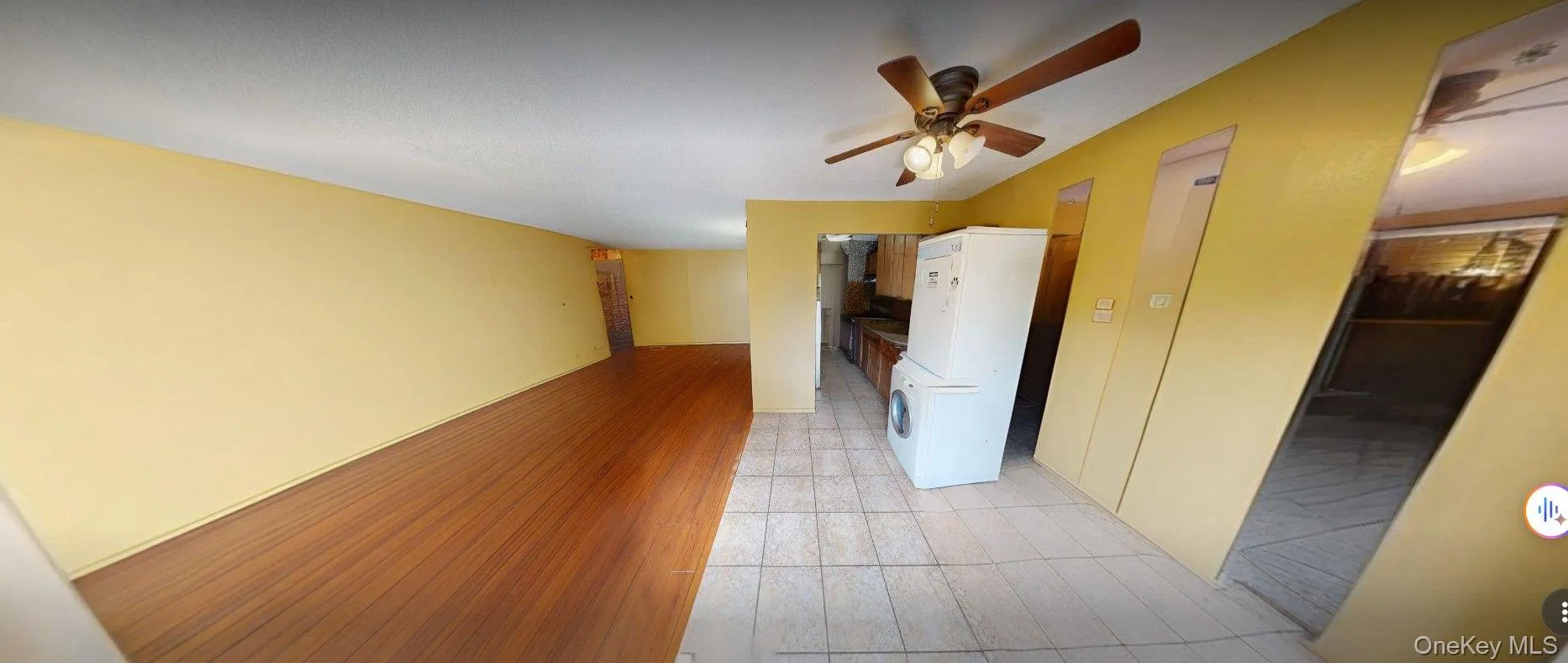 unfurnished view into kitchen & living area from balcony unfurnished view into kitchen & living area from balcony