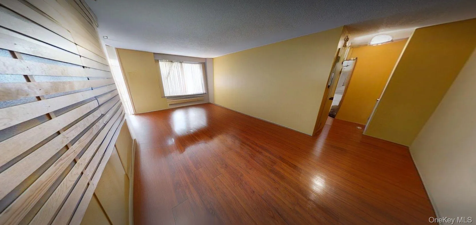 unfurnished view of living area and entry way unfurnished view of living area and entry way
