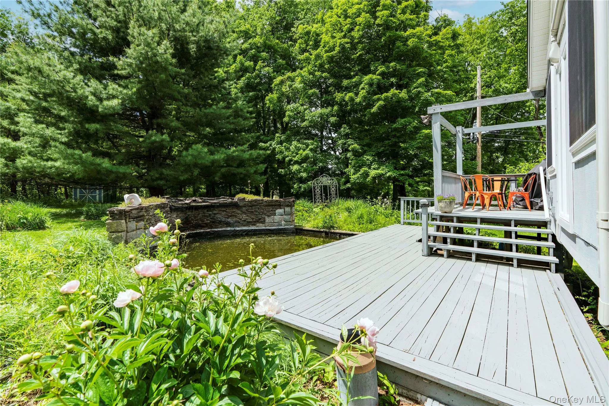 The Extensive Decking Overlooks the Rock Garden and Koi Pond The Extensive Decking Overlooks the Rock Garden and Koi Pond