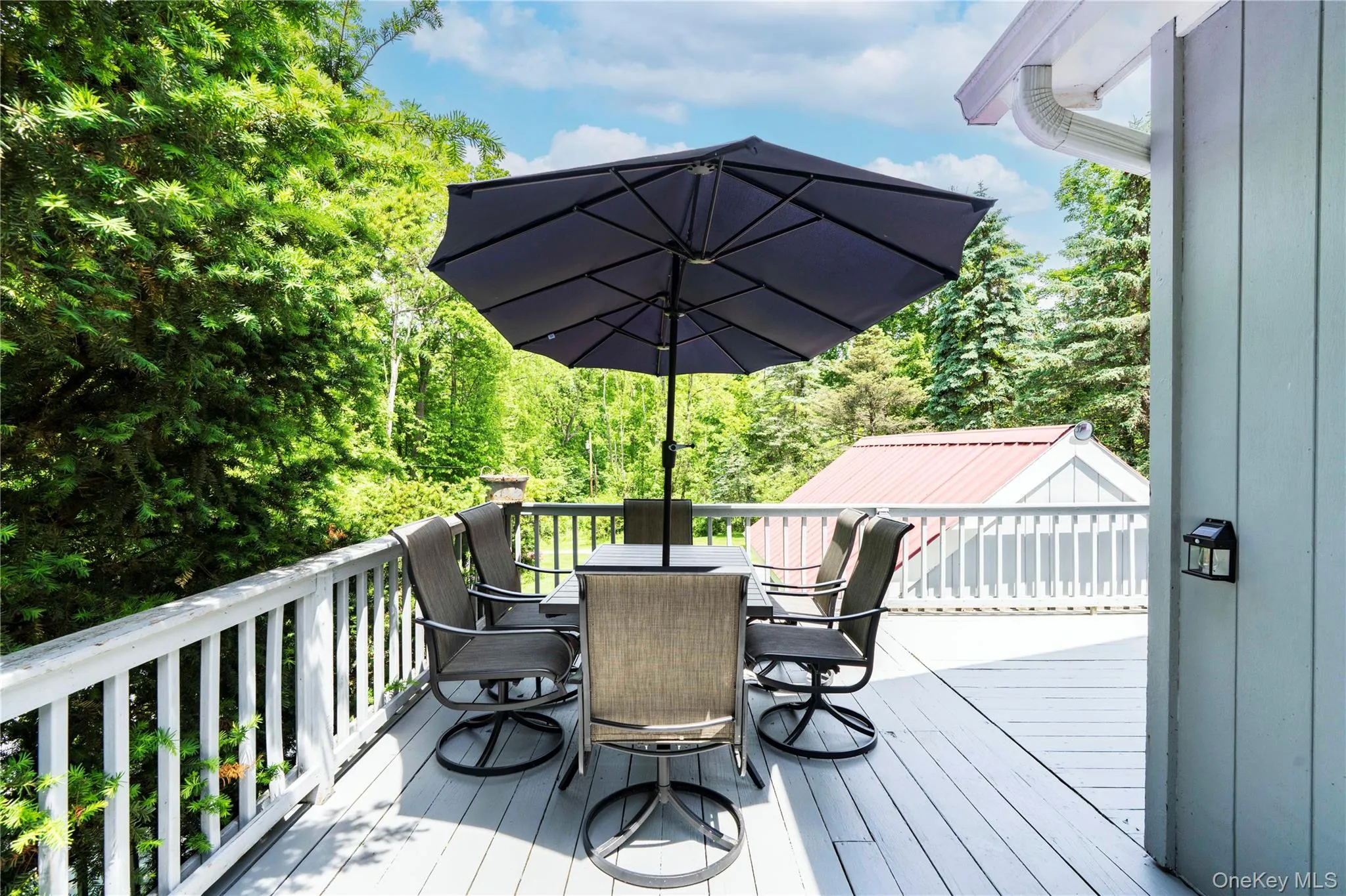 The Extensive Decking Provides Multiple Sitting and Dining Areas The Extensive Decking Provides Multiple Sitting and Dining Areas