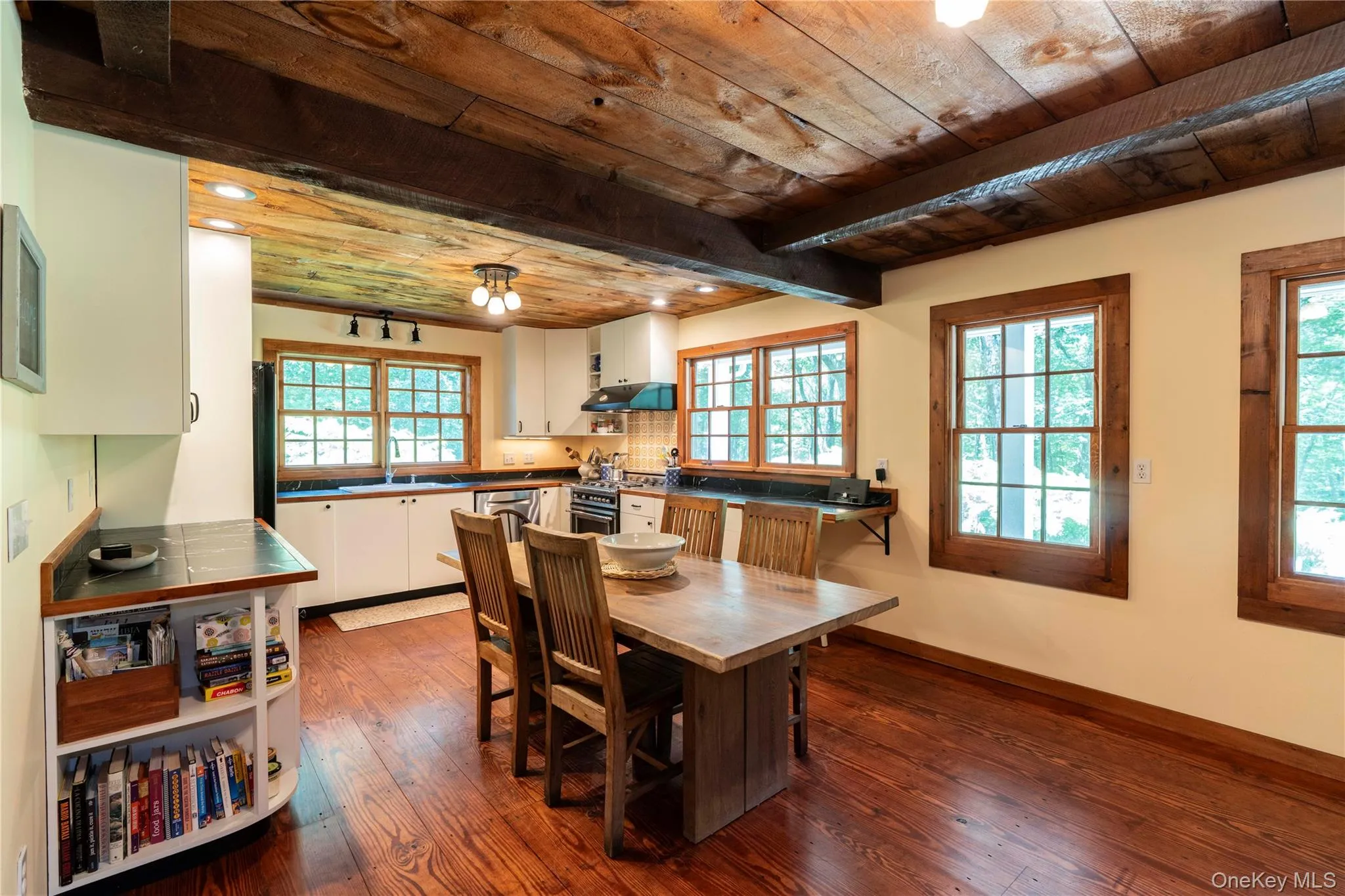 Light Filled with Walls of Windows in Dining Area & Kitchen Light Filled with Walls of Windows in Dining Area & Kitchen