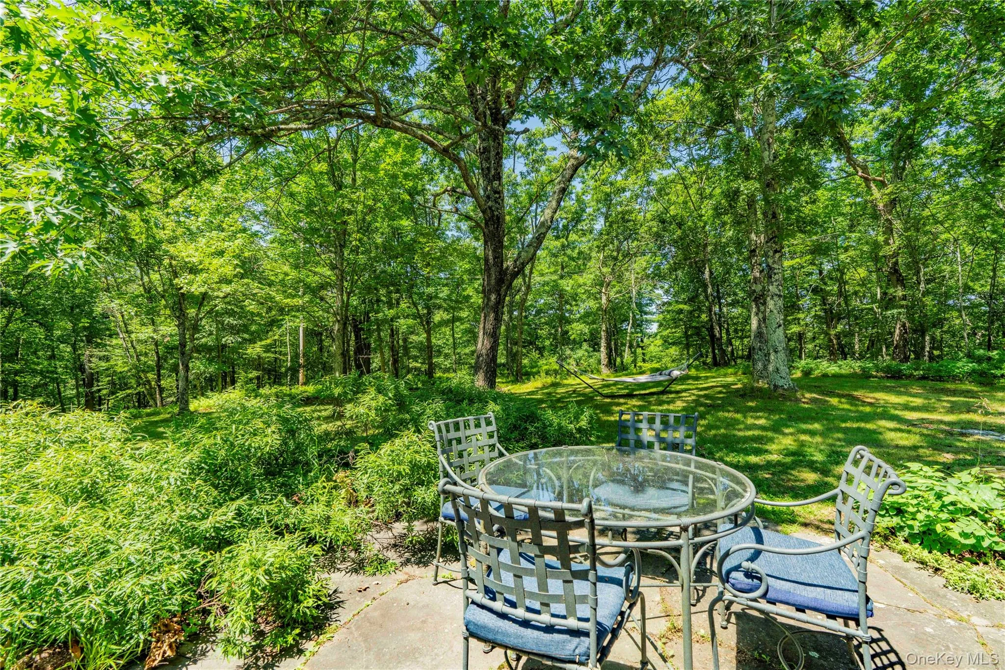 The Patio Dining Area is Surrounded by Natural Gardens The Patio Dining Area is Surrounded by Natural Gardens