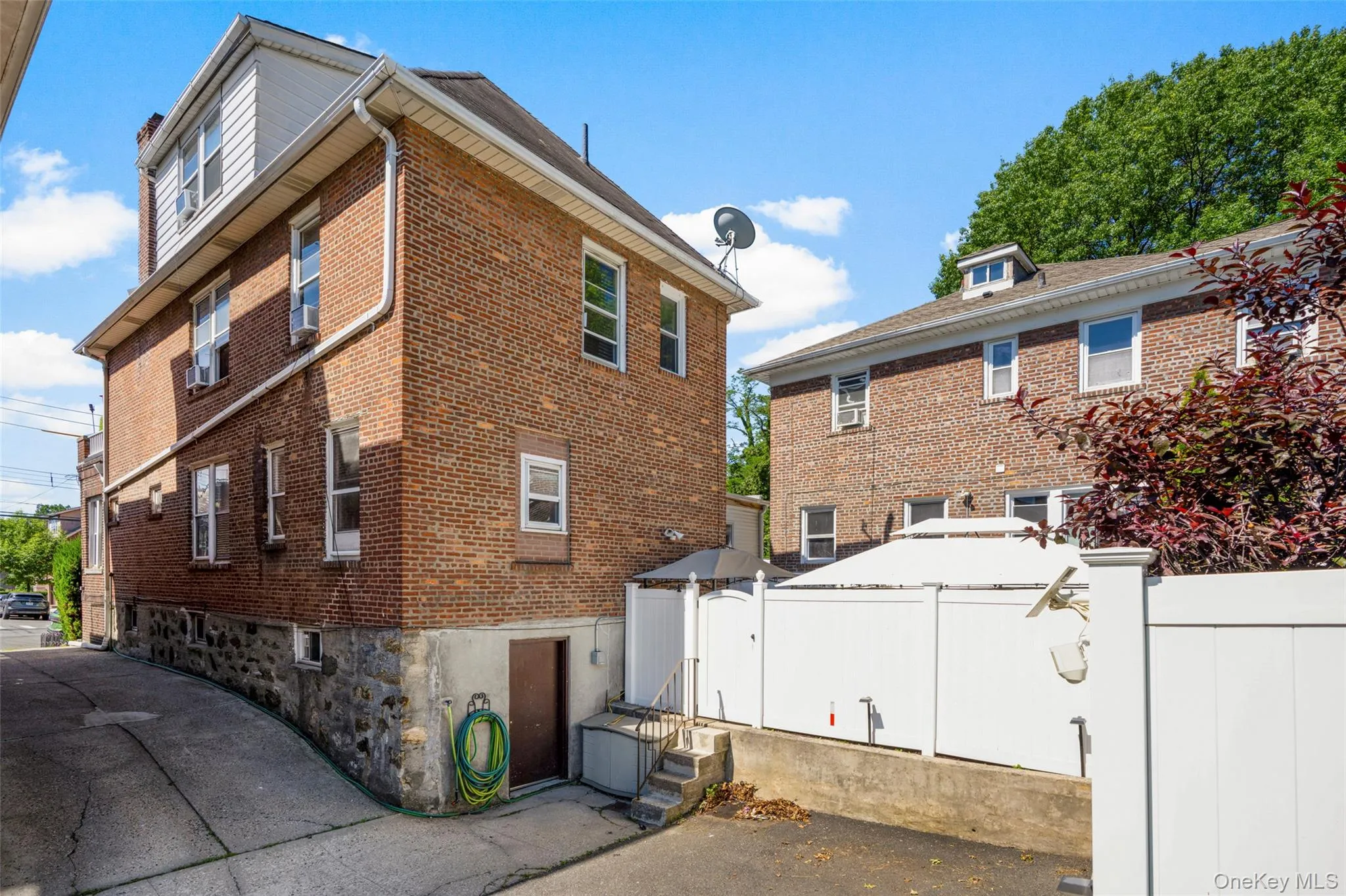 Rear of Structure - Parking and Privacy Fence around rear yard. Rear of Structure - Parking and Privacy Fence around rear yard.