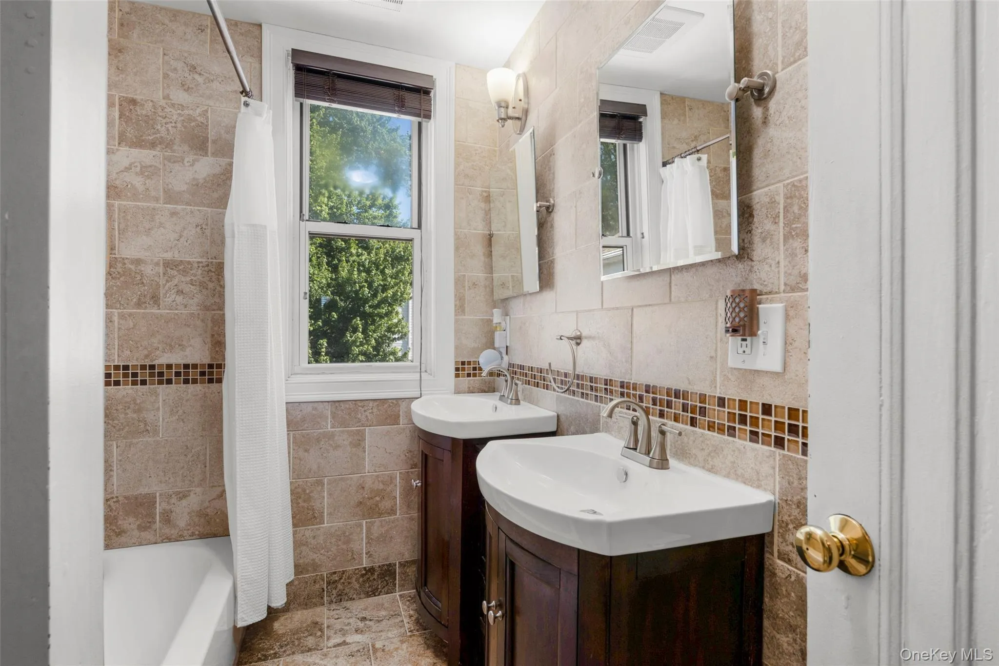 2nd Floor Full Hall Bath with double sink. 2nd Floor Full Hall Bath with double sink.