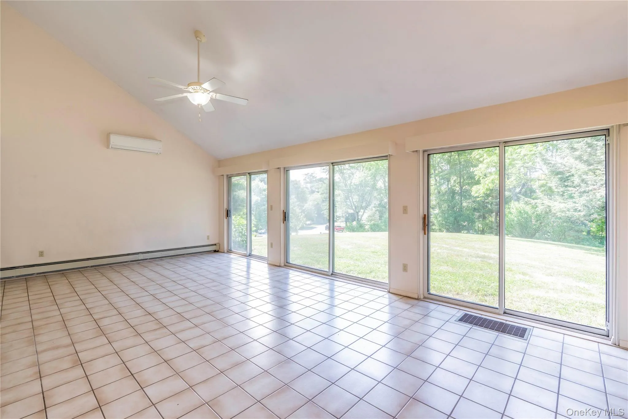 South Facing Great Room with a Wall of Glass Doors South Facing Great Room with a Wall of Glass Doors