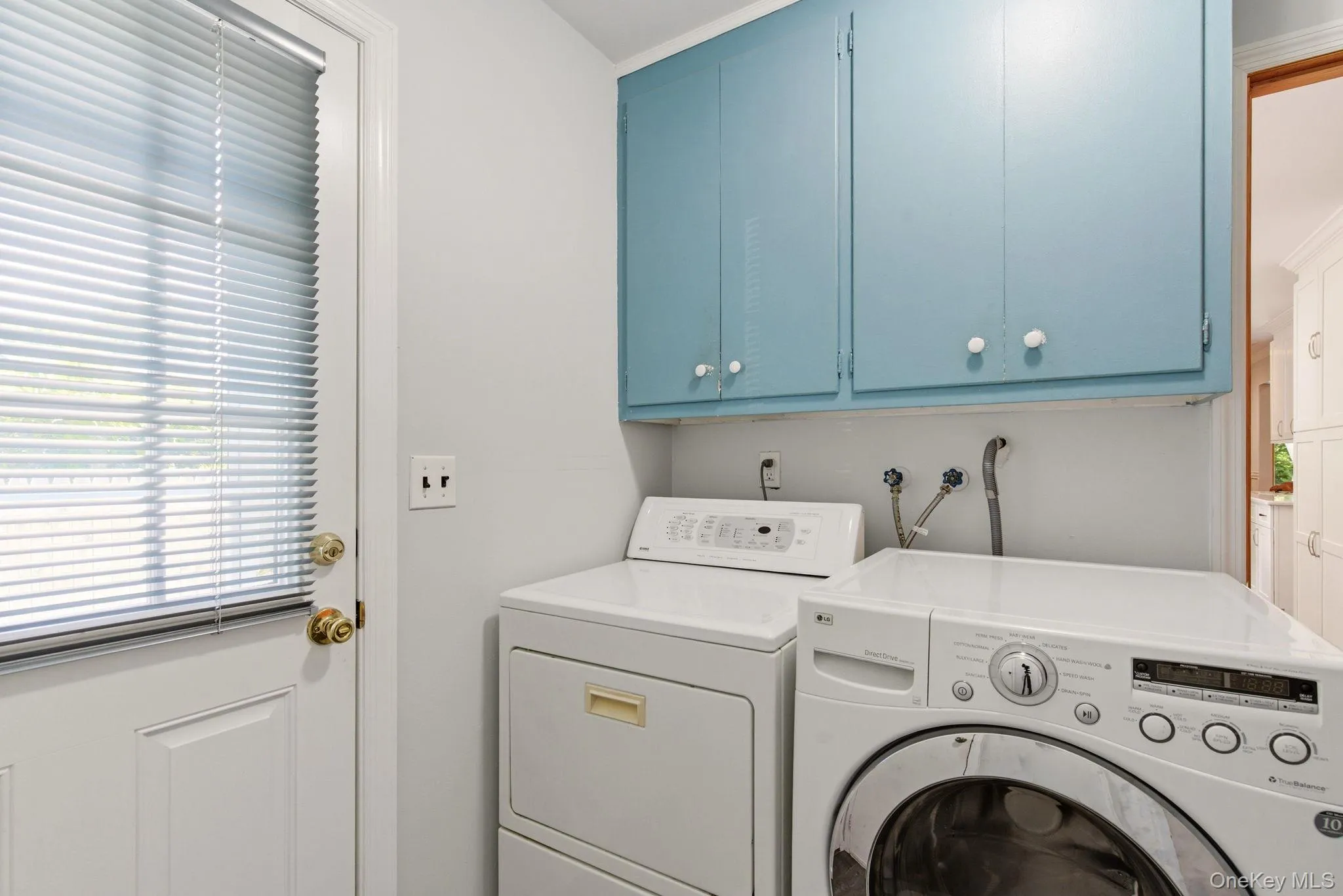Laundry room with access to side yard Laundry room with access to side yard