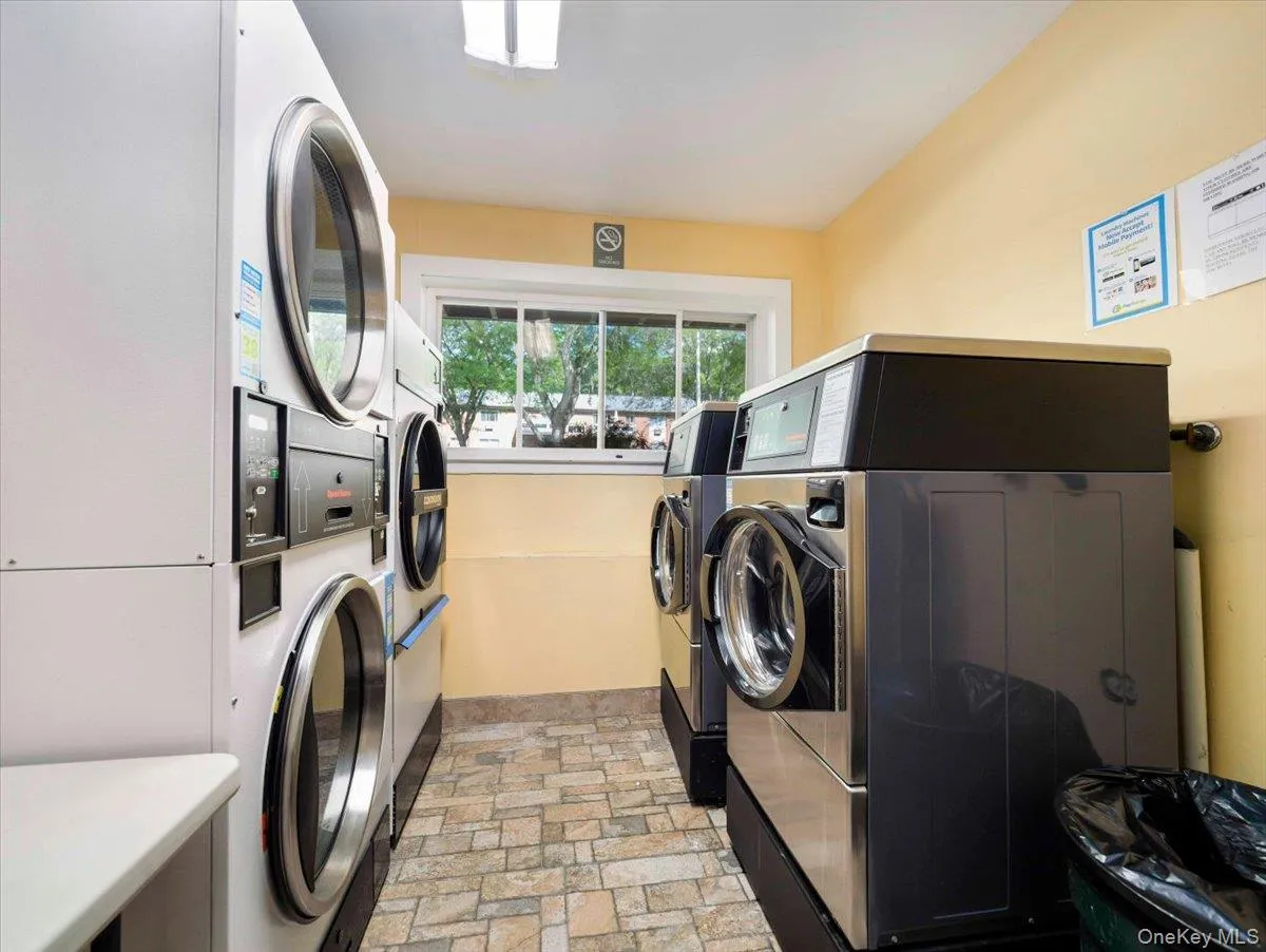Laundry room with commercial-grade washing machines and dryers Laundry room with commercial-grade washing machines and dryers