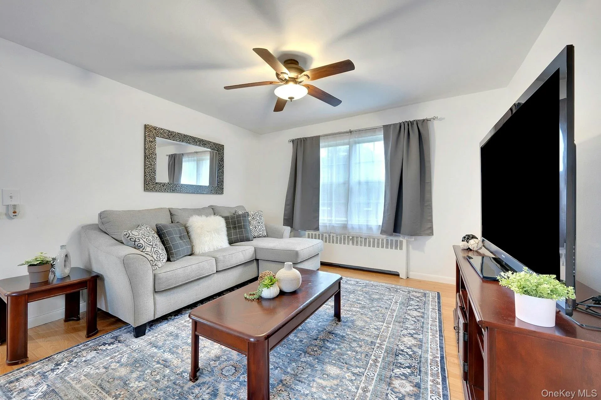 Comfy-size living room that can accommodate a sectional couch and entertainment area Comfy-size living room that can accommodate a sectional couch and entertainment area