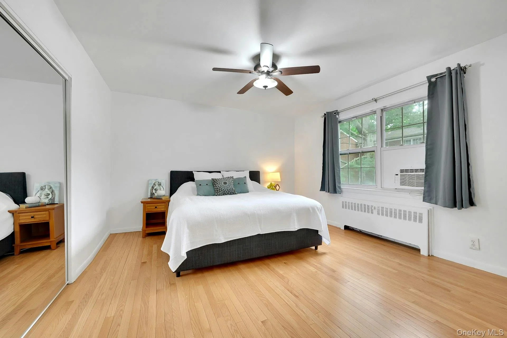 Spacious primary bedroom with large window to bring in the natural light Spacious primary bedroom with large window to bring in the natural light