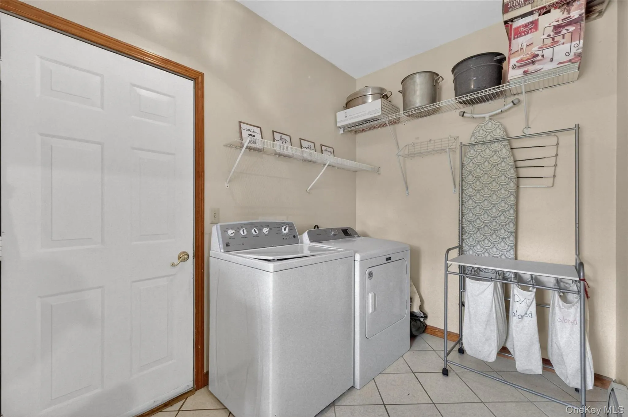 First floor Laundry Room with access to the Garage and Backyard First floor Laundry Room with access to the Garage and Backyard