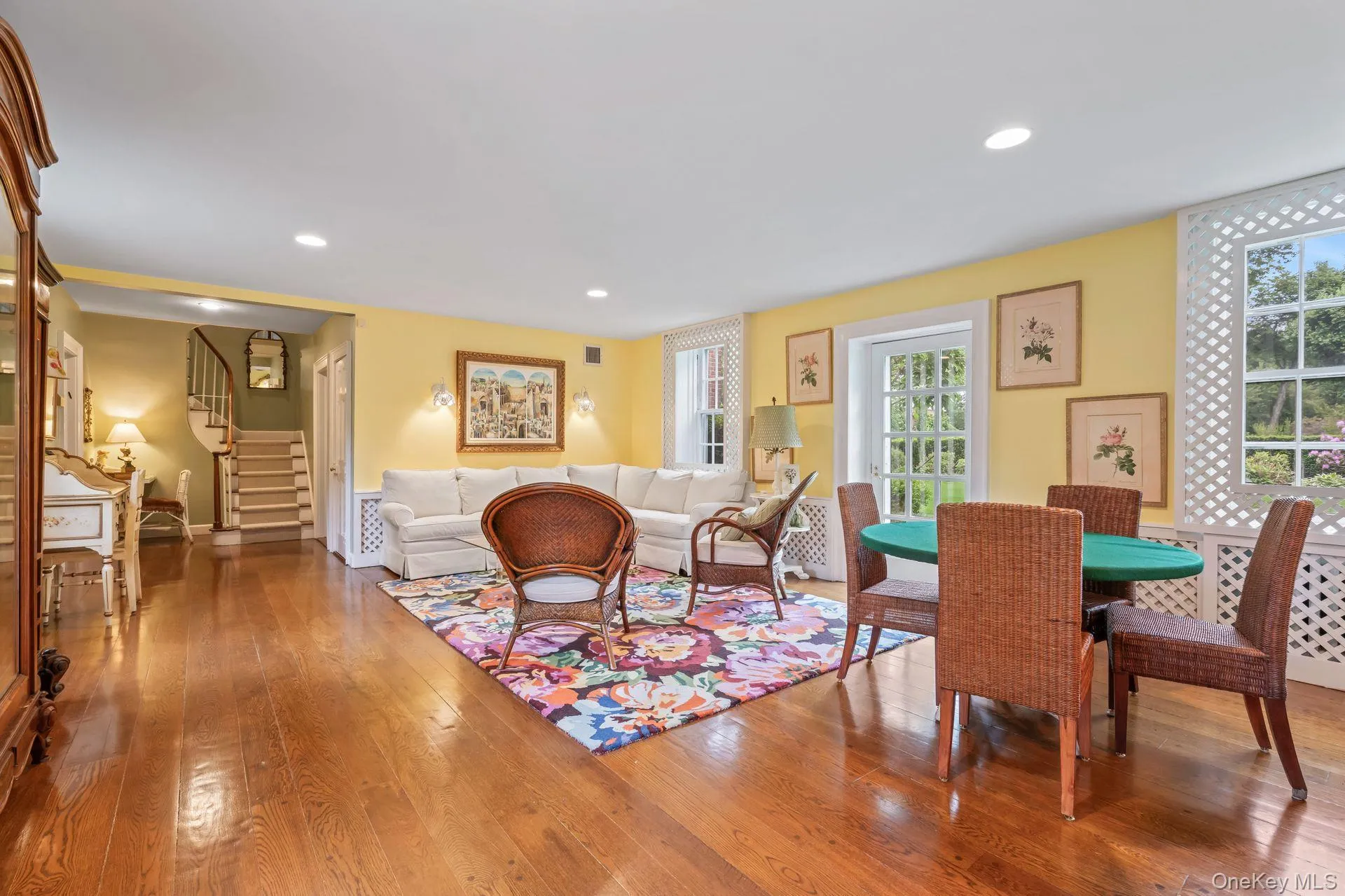 Sunroom with abundance of natural light and back staircase Sunroom with abundance of natural light and back staircase