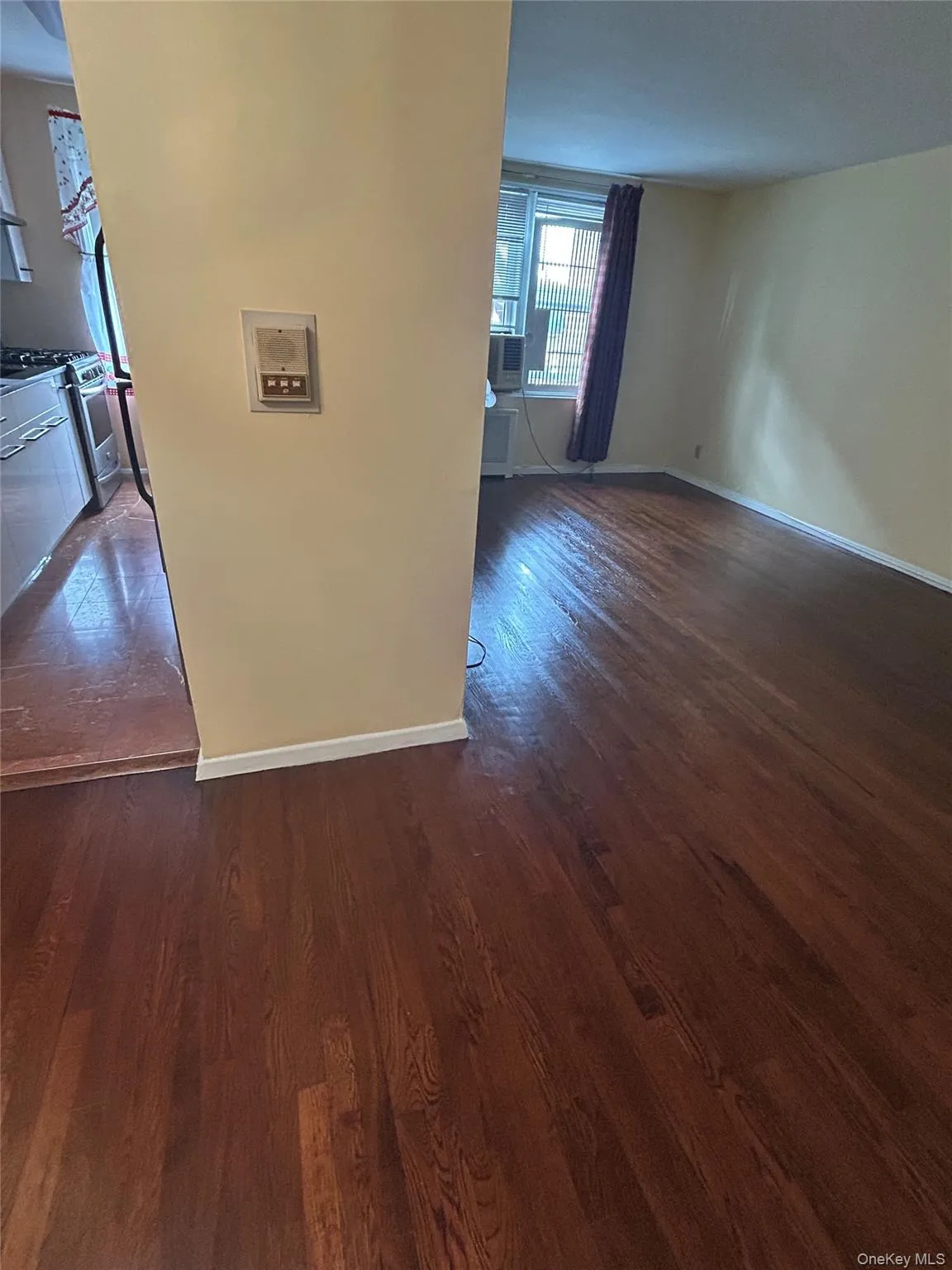 View from the entry foyer: Living room on right; kitchen on left. View from the entry foyer: Living room on right; kitchen on left.