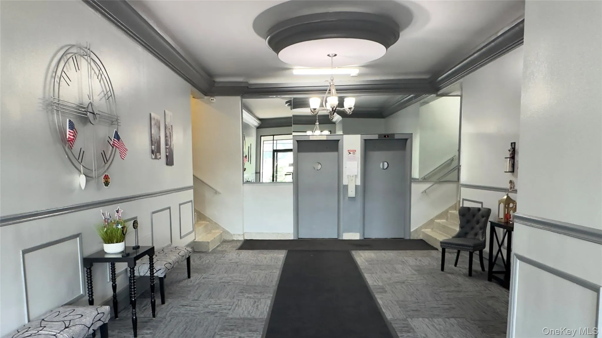 Modern remodeled lobby looking in towards elevators. Modern remodeled lobby looking in towards elevators.