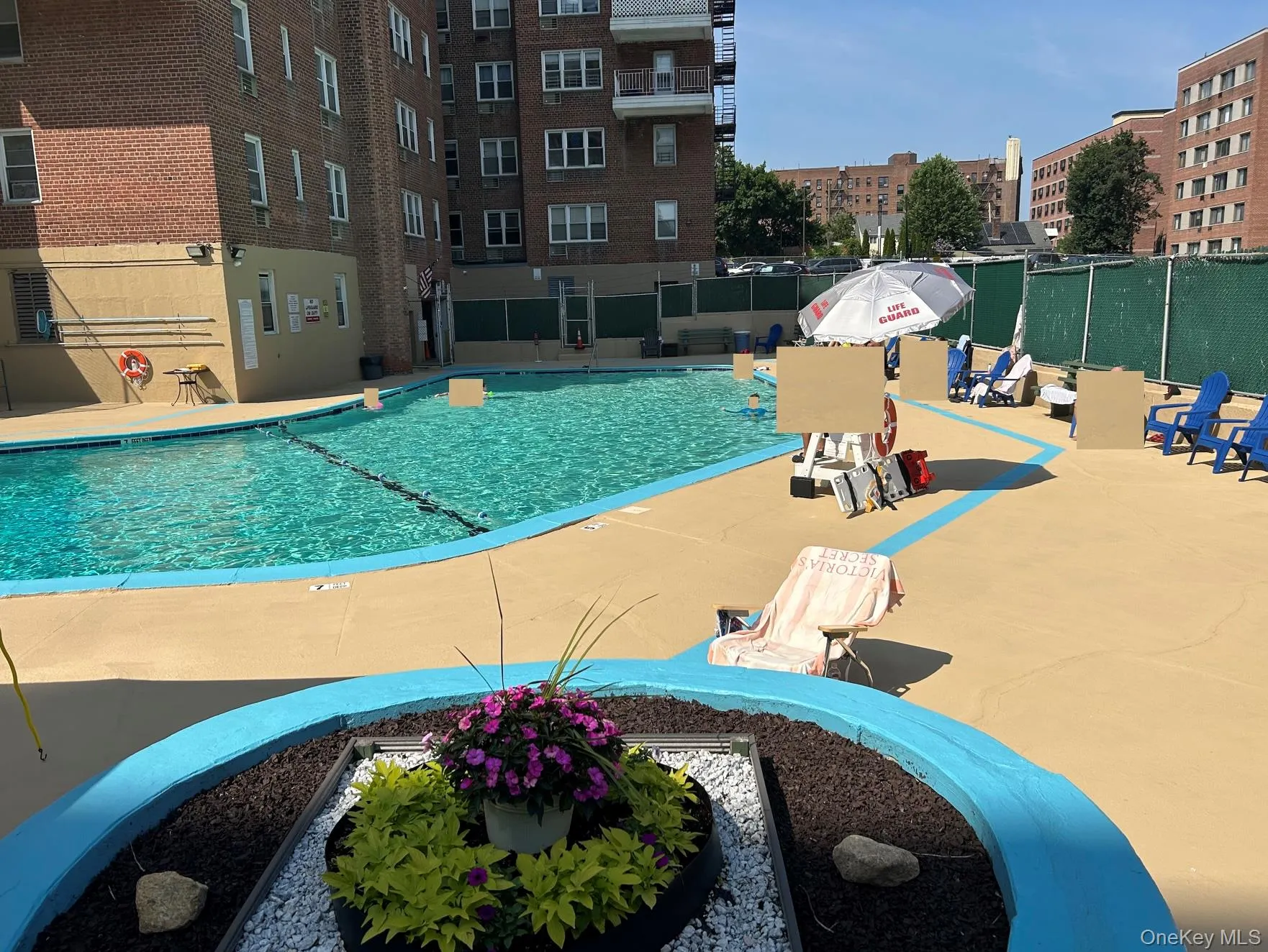 Outdoor swimming pool shows lifeguard Outdoor swimming pool shows lifeguard