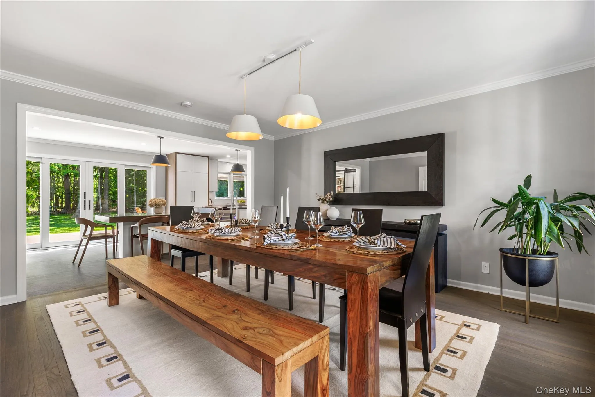 The dining room accomodates large gatherings and enjoys front and back views of the property. The dining room accomodates large gatherings and enjoys front and back views of the property.