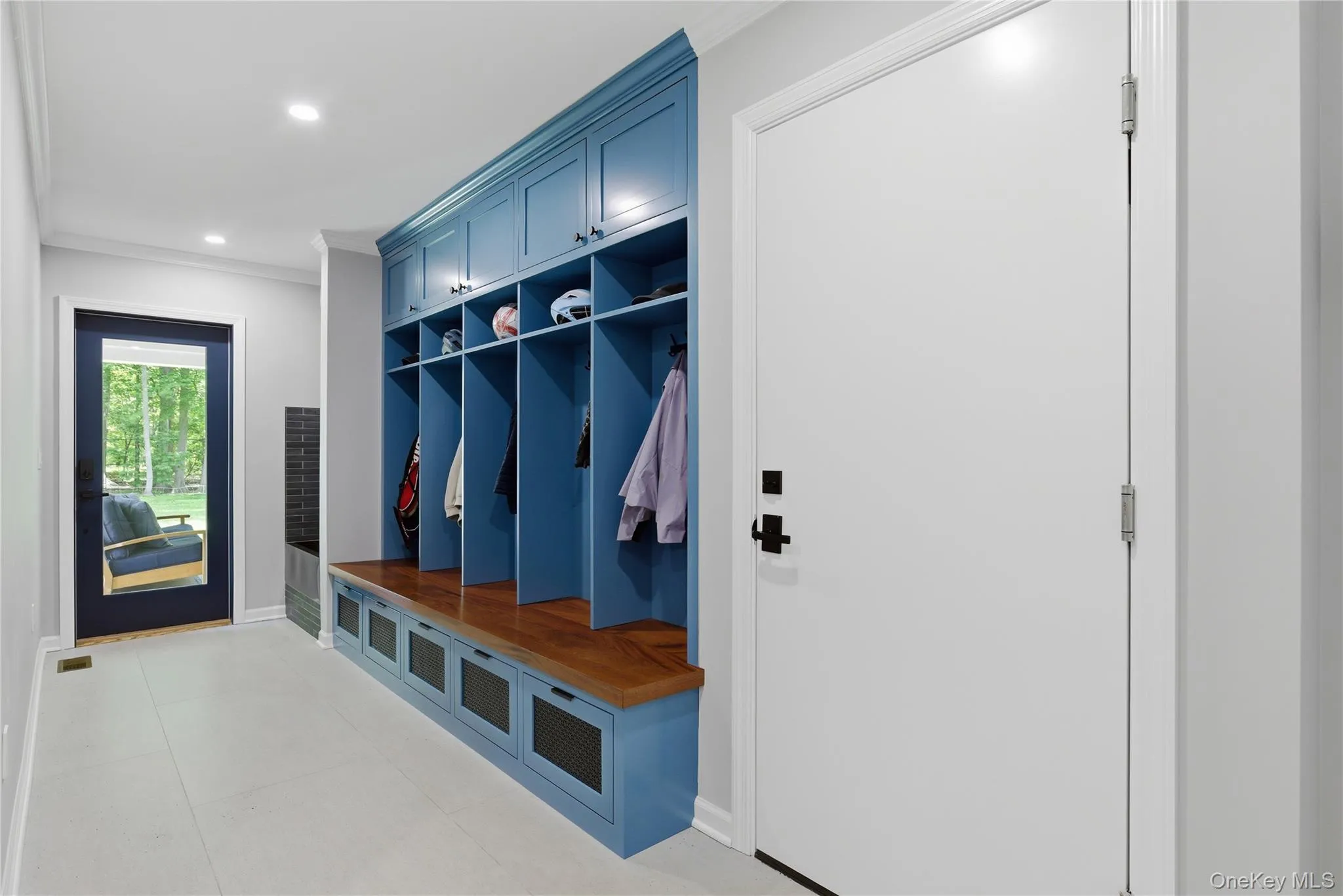 The state-of-the-art mudroom adjacent to the 3-car garage brings storage efficiency to a new aesthetic level. The state-of-the-art mudroom adjacent to the 3-car garage brings storage efficiency to a new aesthetic level.