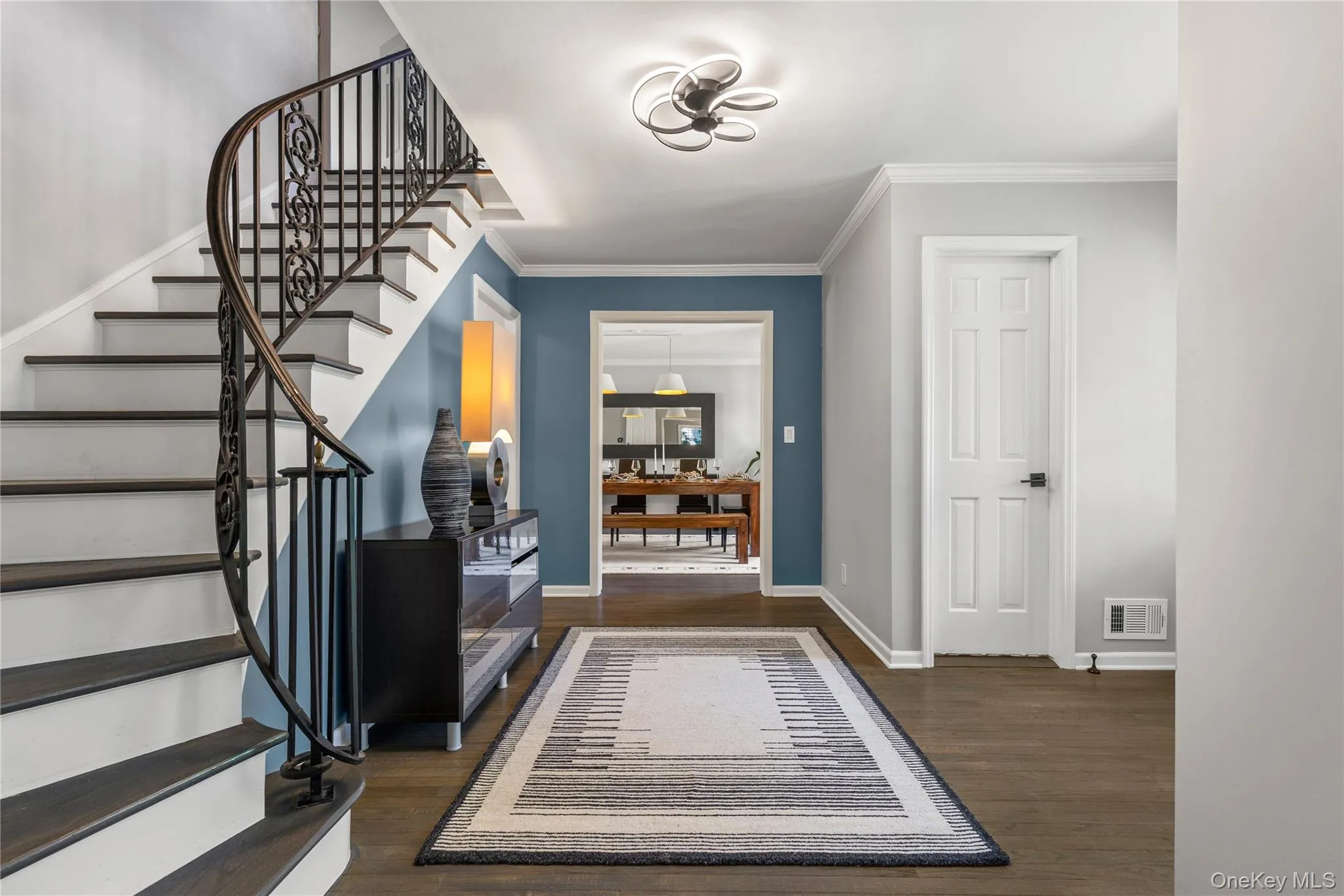 The staircase up to the second floor curves gently from the entrance foyer to the intimate quarters of the home. The staircase up to the second floor curves gently from the entrance foyer to the intimate quarters of the home.
