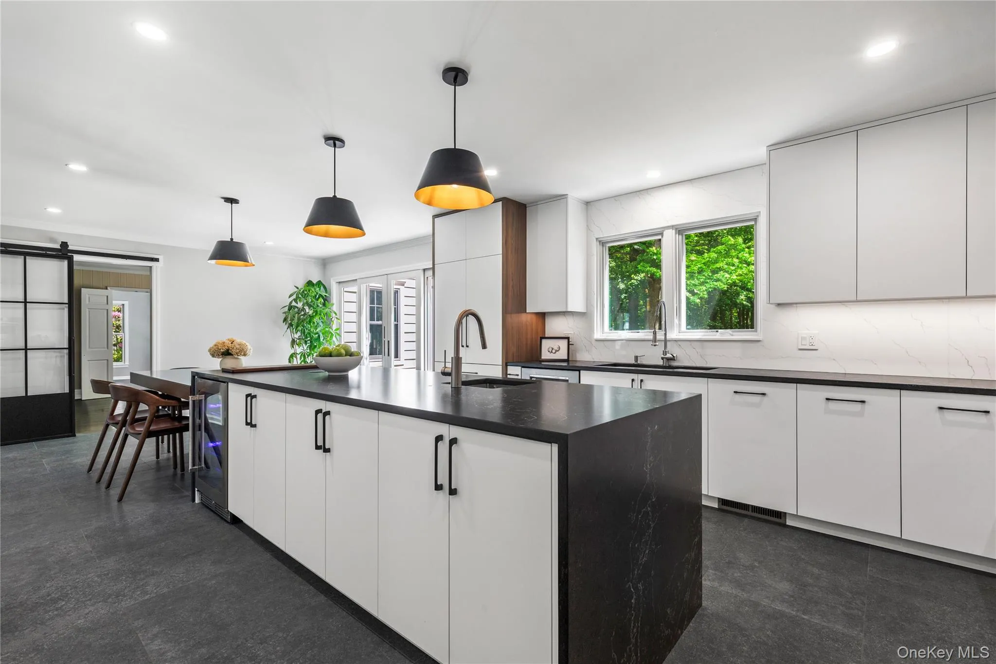 The sliding Barn door from the breakfast area to the family room affords a choice between connection or delineation. The sliding Barn door from the breakfast area to the family room affords a choice between connection or delineation.