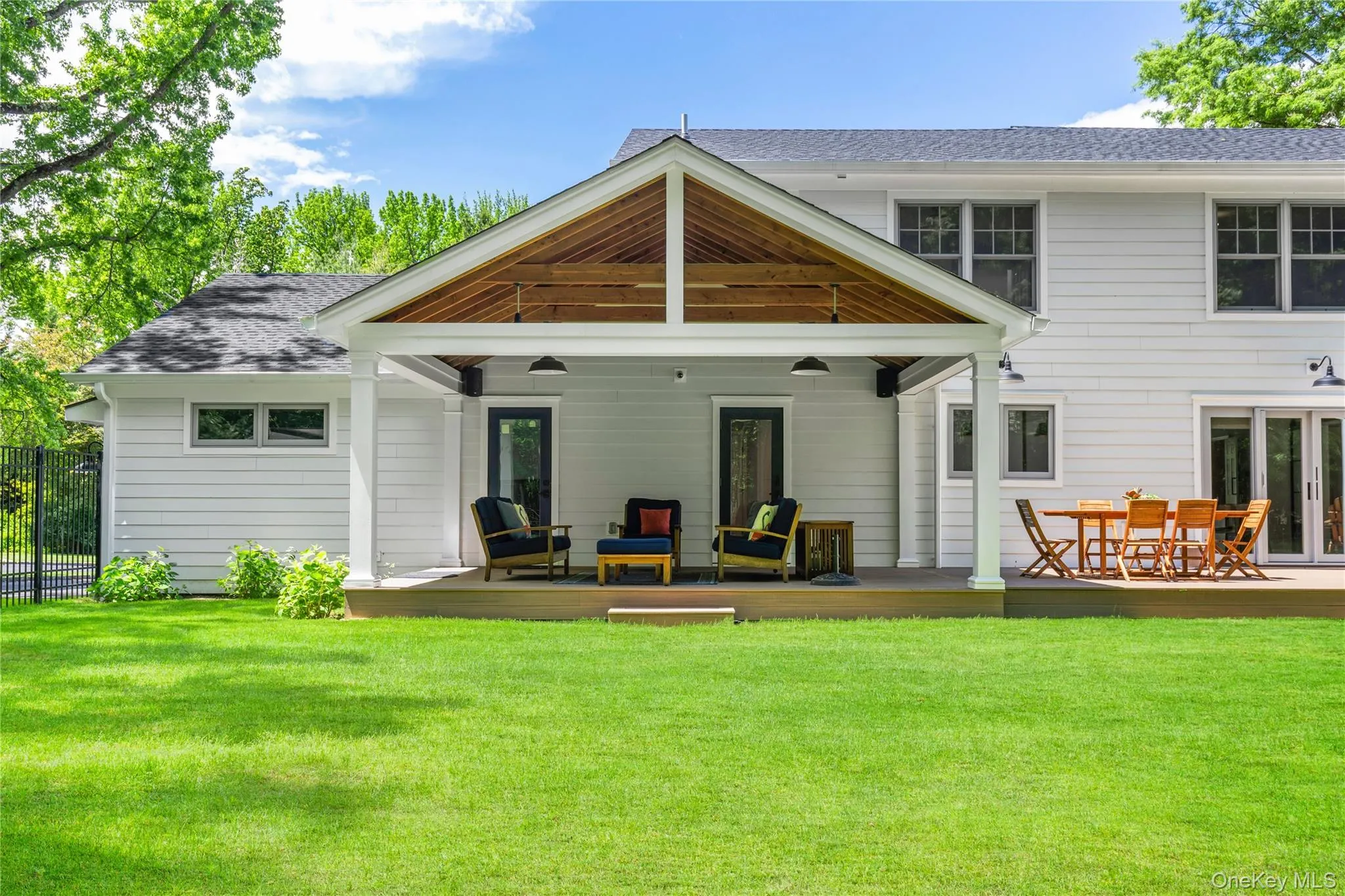 The lofty, covered deck is a magical, protected, outdoor space from which to enjoy the surrounding nature. The lofty, covered deck is a magical, protected, outdoor space from which to enjoy the surrounding nature.
