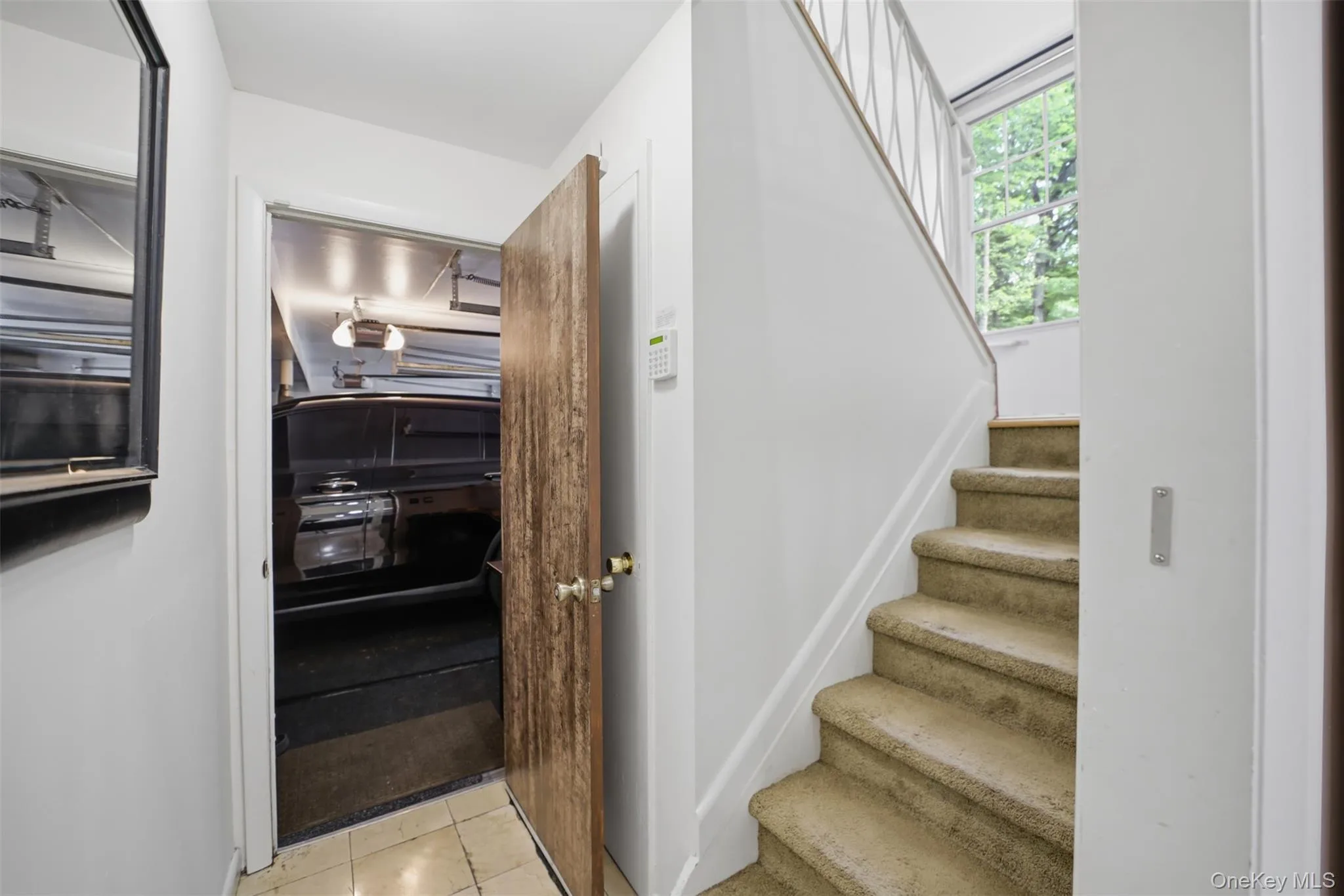 stairs goes to the lower level with garage entrance stairs goes to the lower level with garage entrance