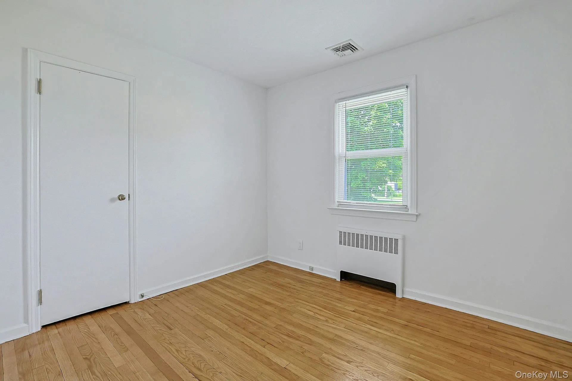 Bedroom #2 with hardwood flooring Bedroom #2 with hardwood flooring