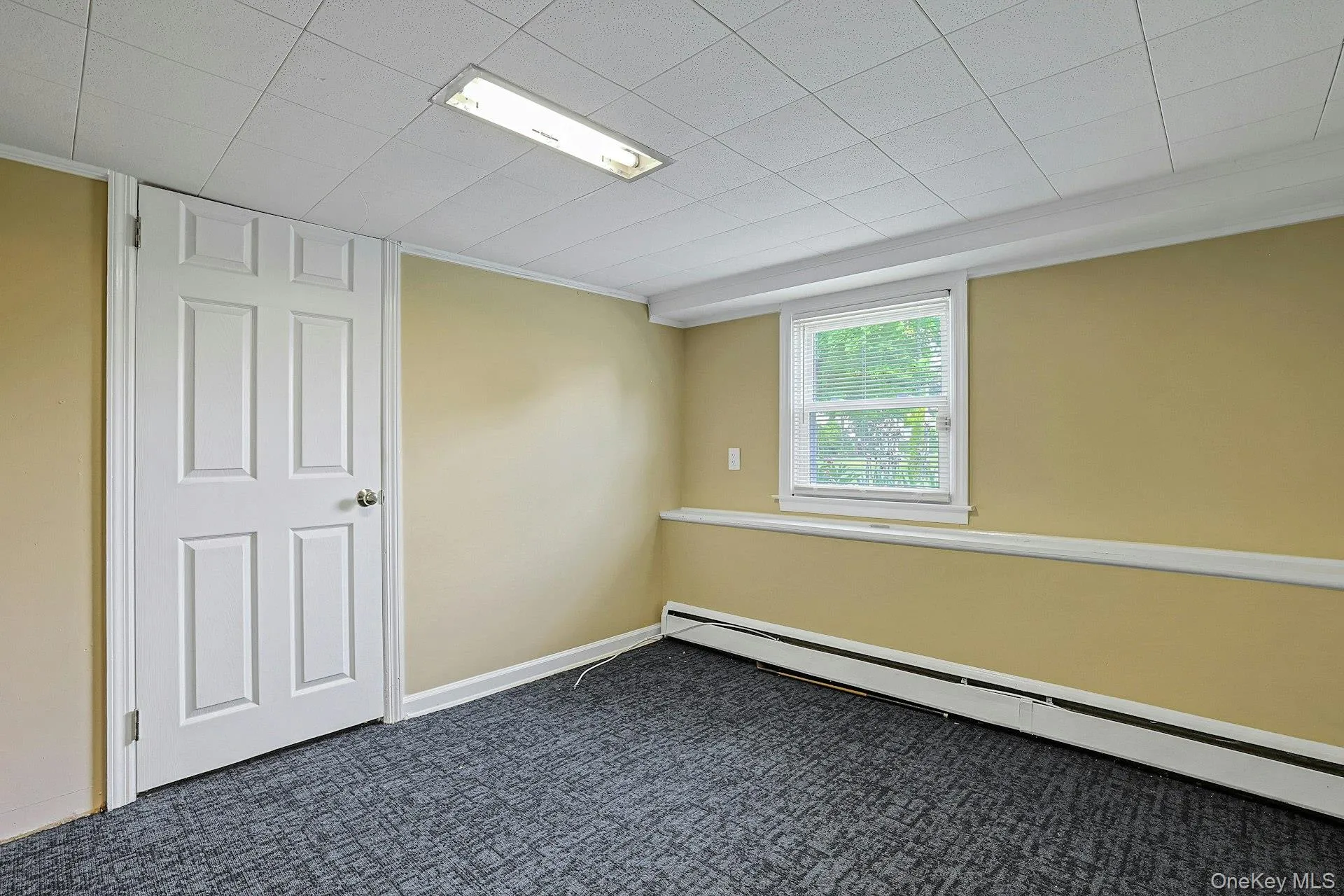 Lower level den or playroom, office, home gym or yoga studio Lower level den or playroom, office, home gym or yoga studio
