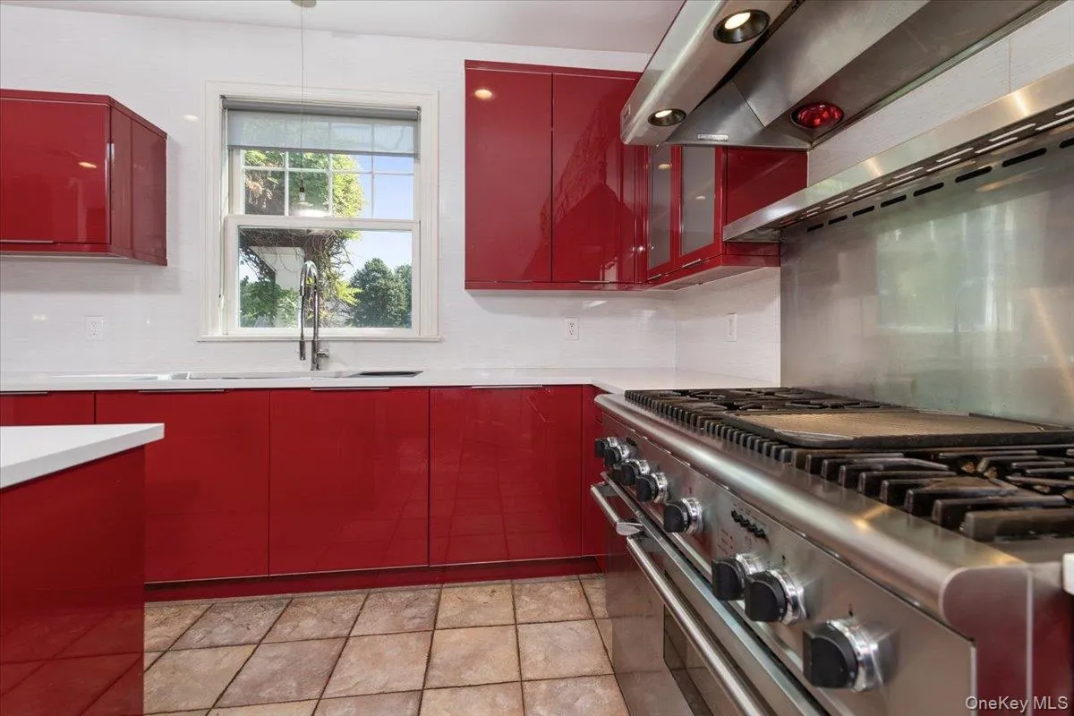 kitchen featuring high end cabinetry and appliances kitchen featuring high end cabinetry and appliances