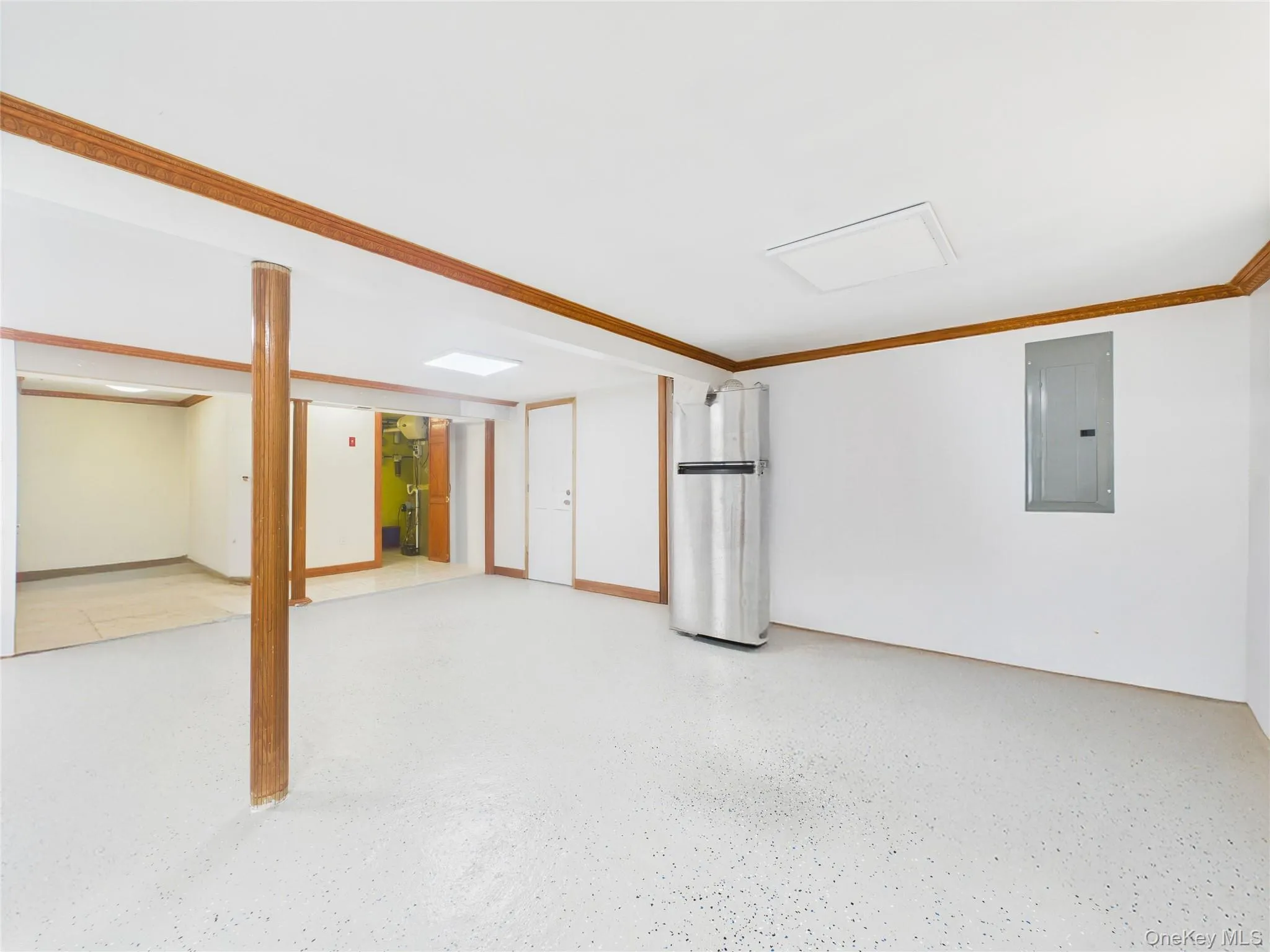 Finished basement with electric panel and ornamental molding Finished basement with electric panel and ornamental molding