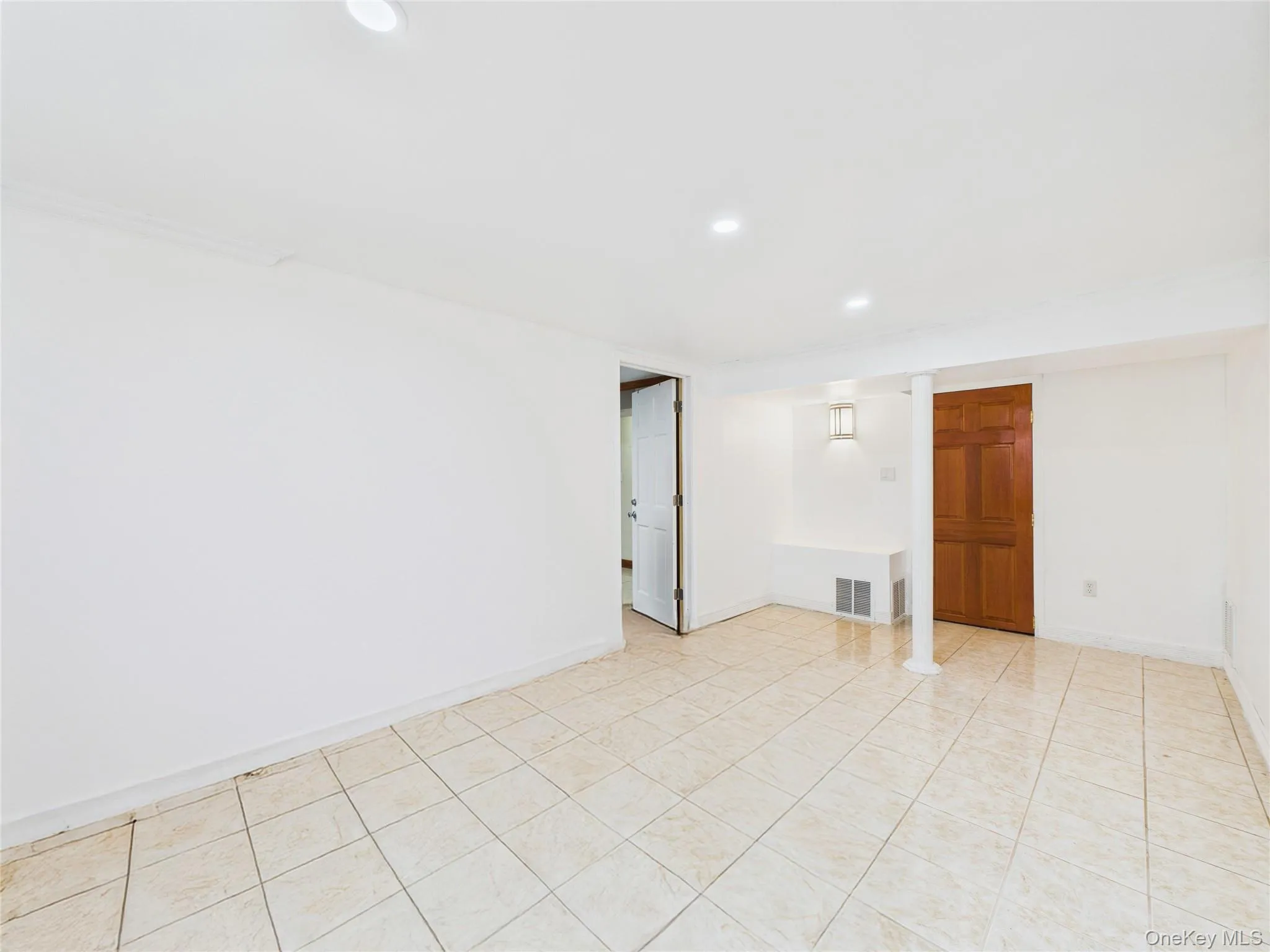 Spare room featuring recessed lighting and baseboards Spare room featuring recessed lighting and baseboards