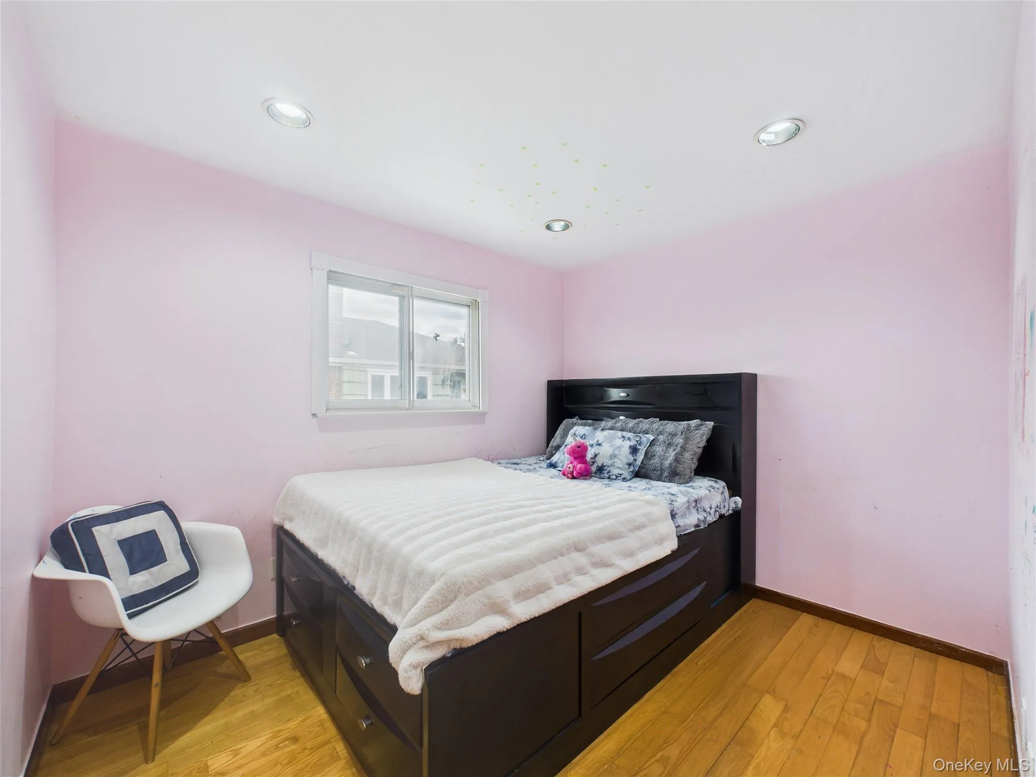 Bedroom featuring light wood finished floors, baseboards, and recessed lighting Bedroom featuring light wood finished floors, baseboards, and recessed lighting