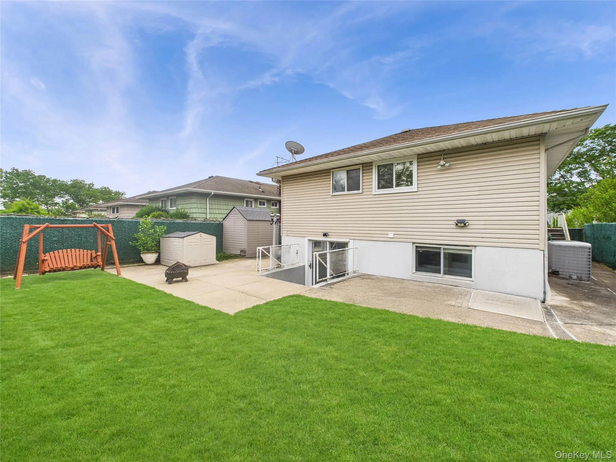 Back of property with a patio area and central AC unit Back of property with a patio area and central AC unit
