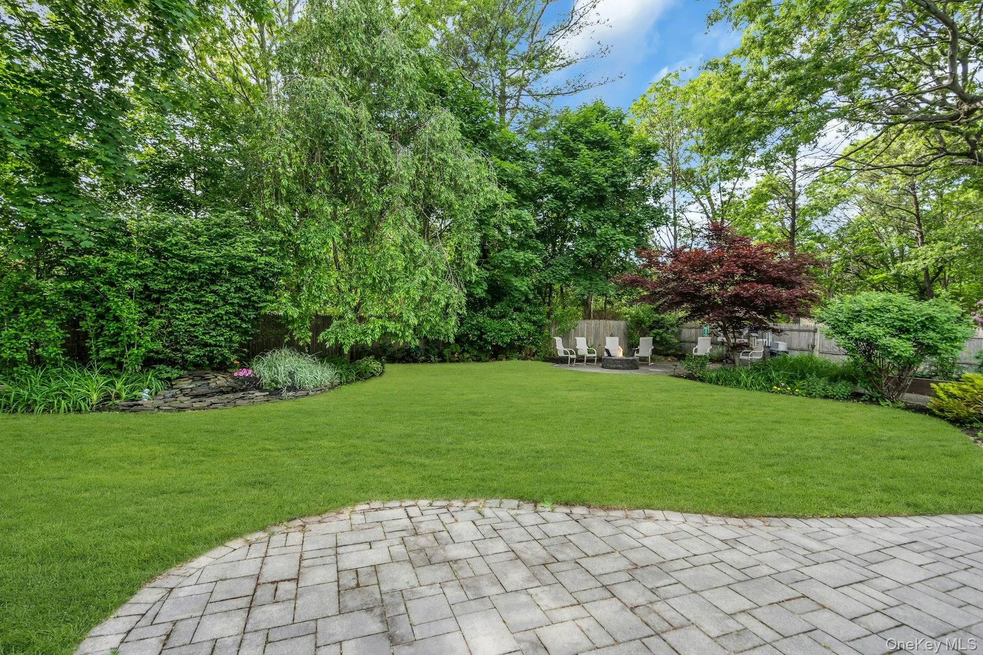 Fully Fenced Backyard With Water Feature Fully Fenced Backyard With Water Feature