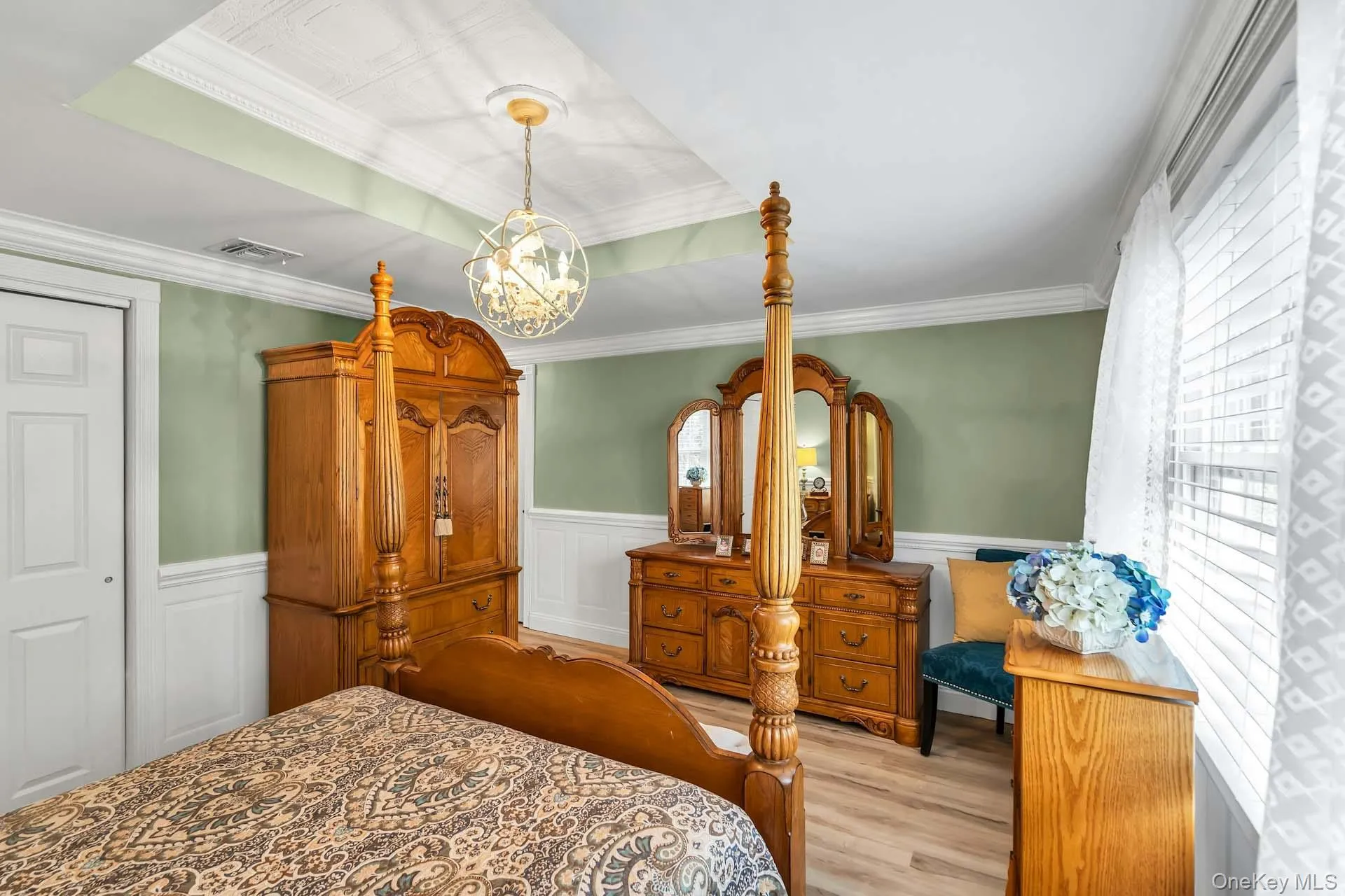 Primary Bedroom With Crown Molding & Wainscot Primary Bedroom With Crown Molding & Wainscot