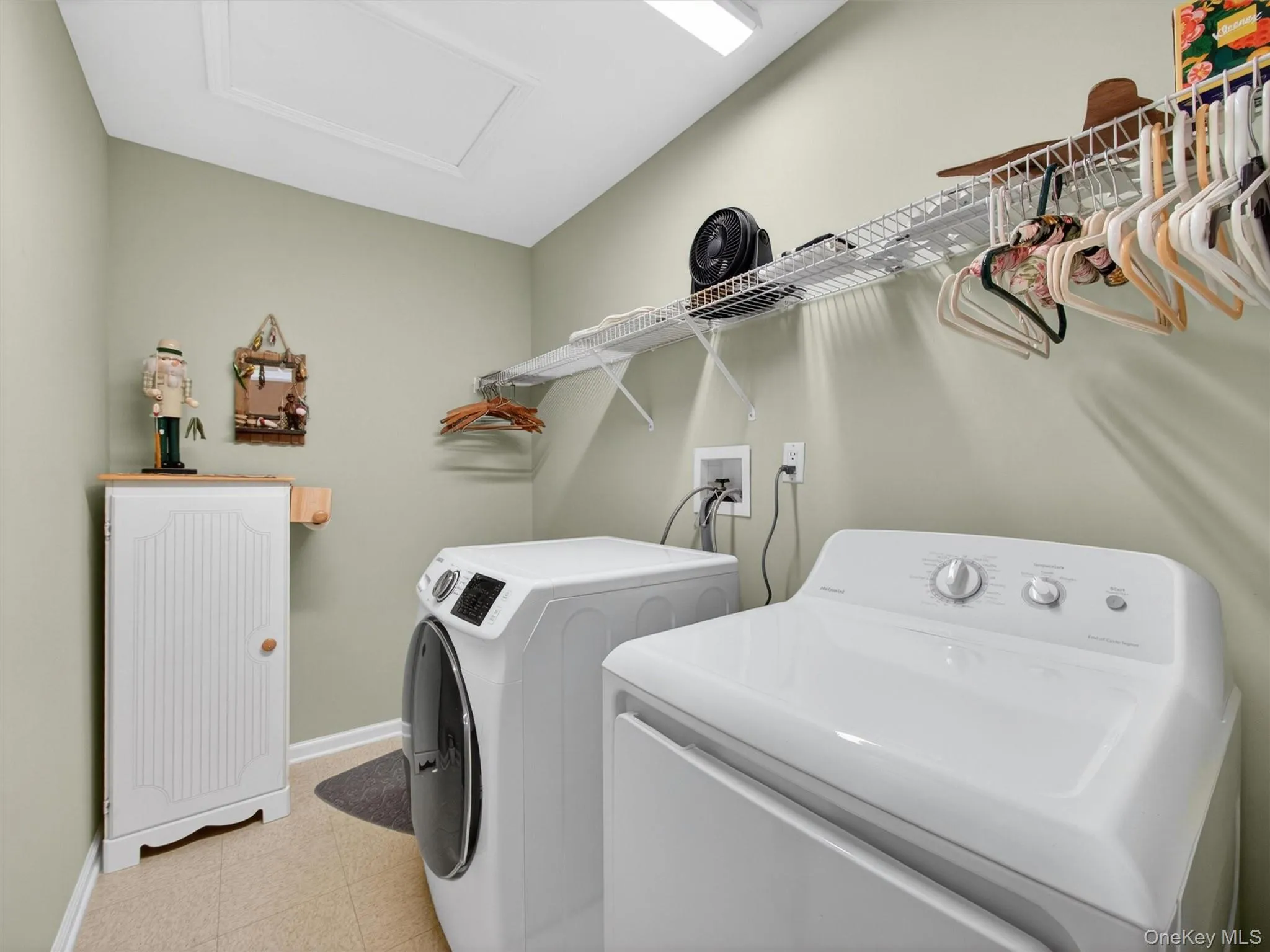 Convenient bedroom level laundry with storage shelving. Convenient bedroom level laundry with storage shelving.