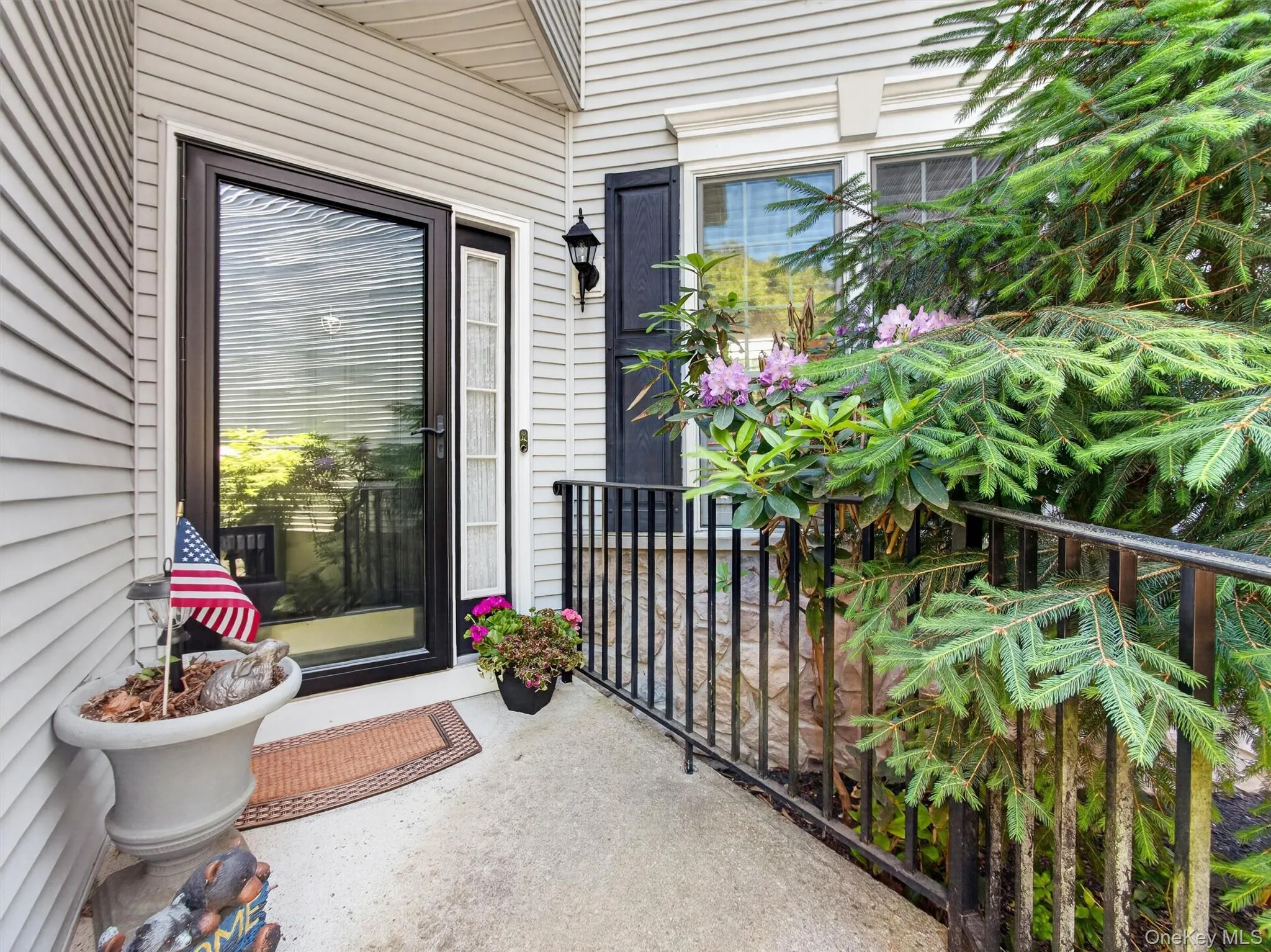 Raised landing with stylish storm door and handrail. Raised landing with stylish storm door and handrail.