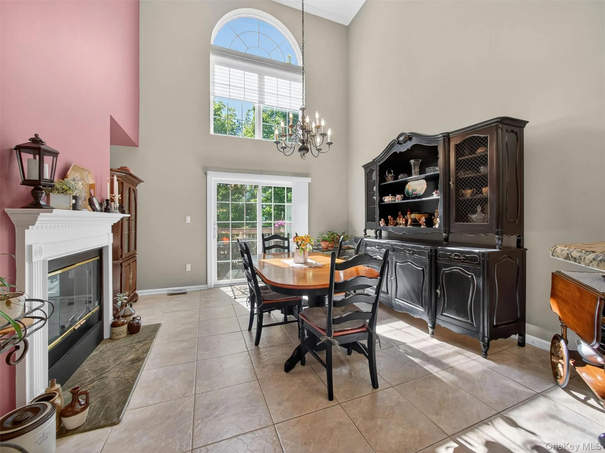 Stunning open-plan formal dining room with approx 20'+ ceiling, arched window, slider to the private deck. Stunning open-plan formal dining room with approx 20'+ ceiling, arched window, slider to the private deck.