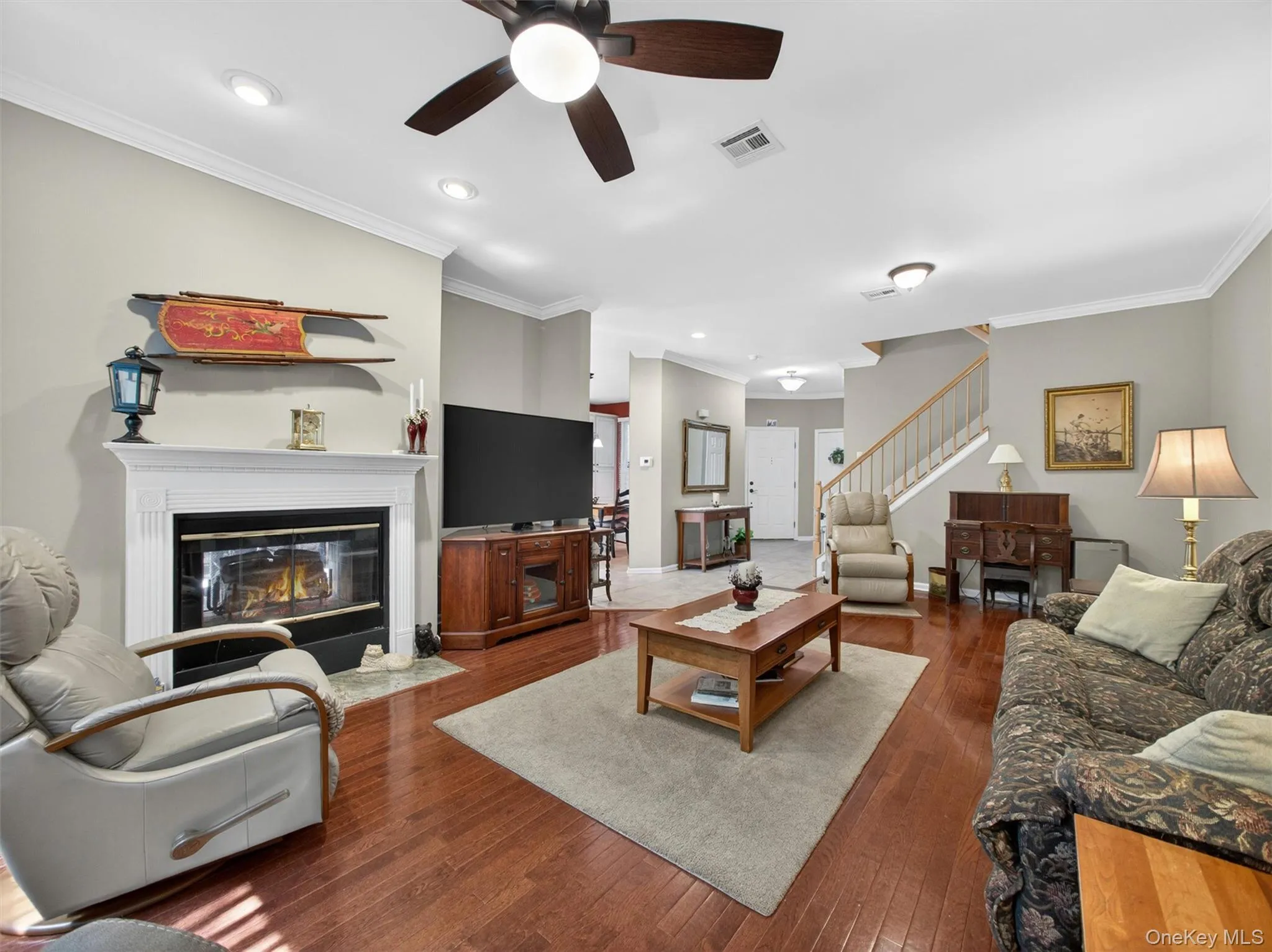 View from the expansive living room with "see-through" fireplace, through to the entry foyer. View from the expansive living room with "see-through" fireplace, through to the entry foyer.