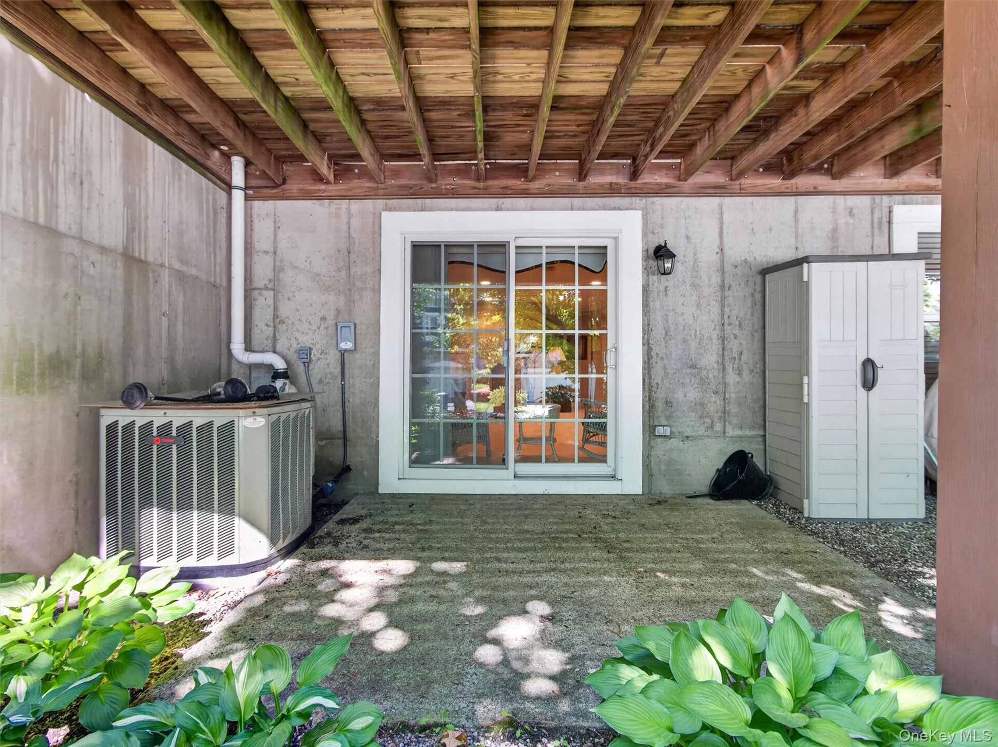 Covered patio outside accessed via sliders from fully finished basement. Covered patio outside accessed via sliders from fully finished basement.