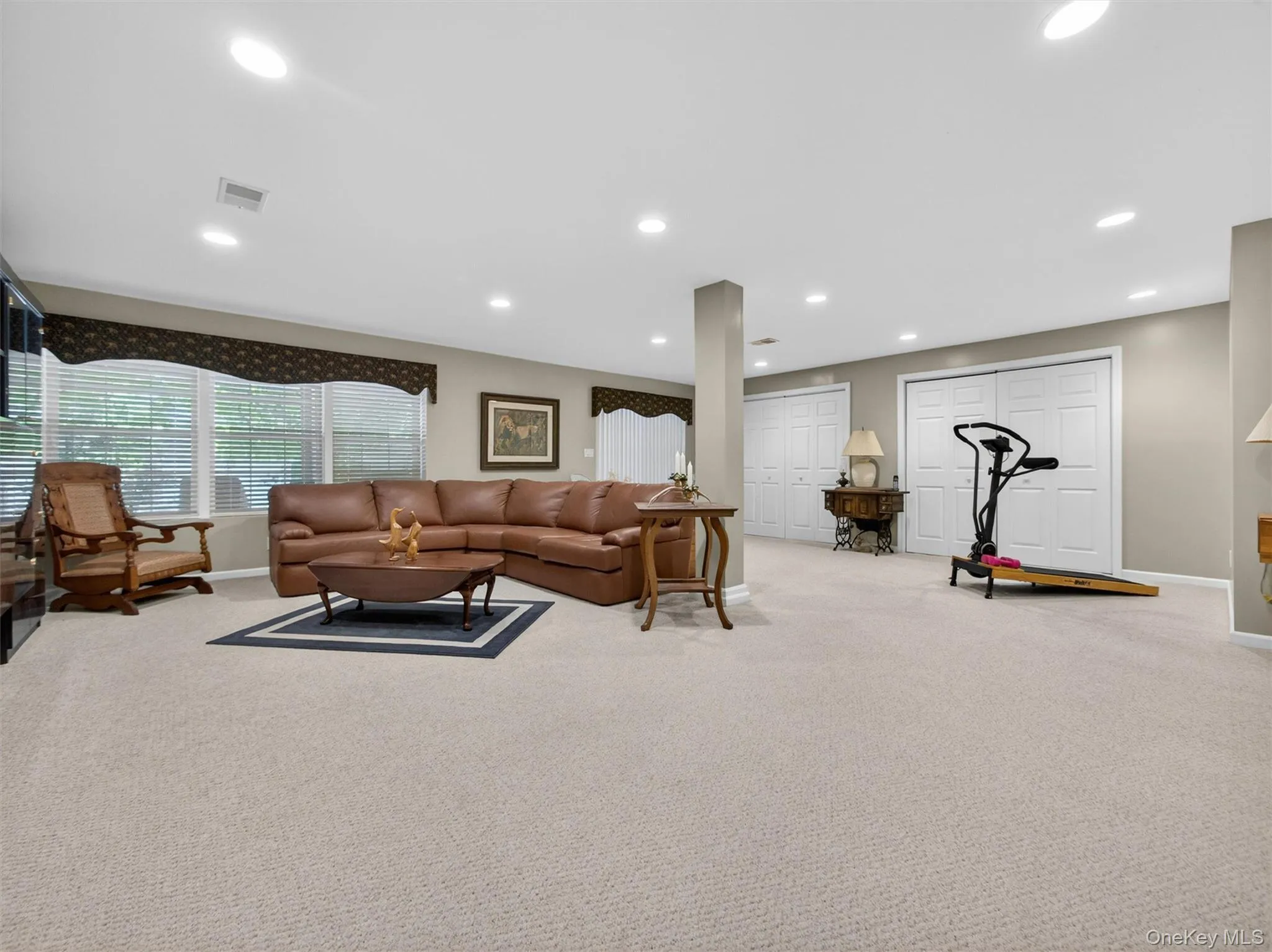 Beautiful basement with full-sized windows, multiple large closets, recessed lighting, all neutral carpeting and slider to a covered patio. Beautiful basement with full-sized windows, multiple large closets, recessed lighting, all neutral carpeting and slider to a covered patio.