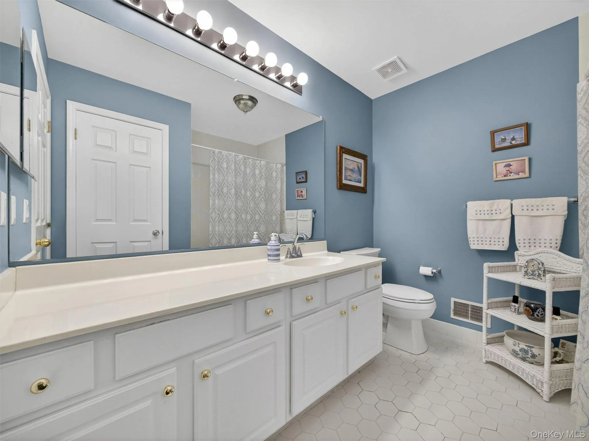 Bedroom level hall bathroom with shower over tub. Bedroom level hall bathroom with shower over tub.